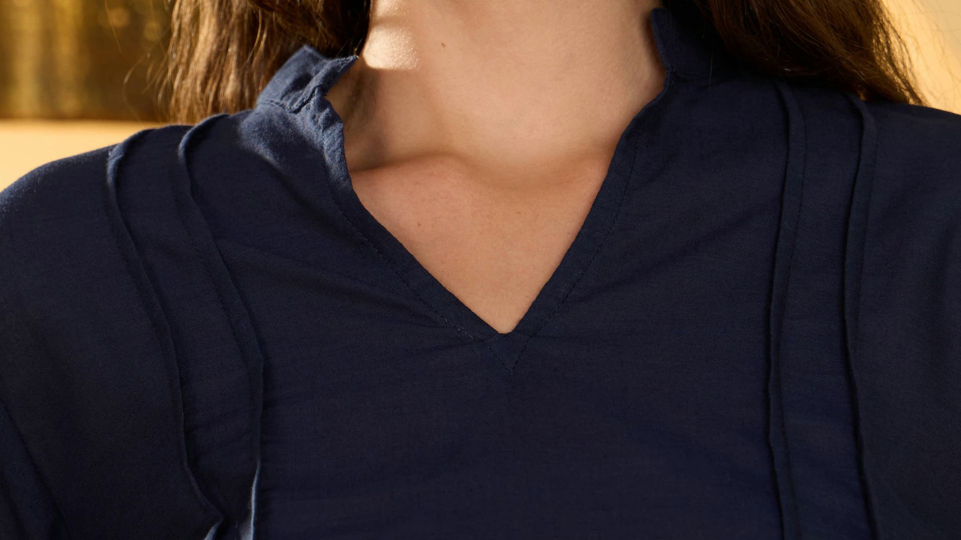 Young woman smiling with sunglasses on head