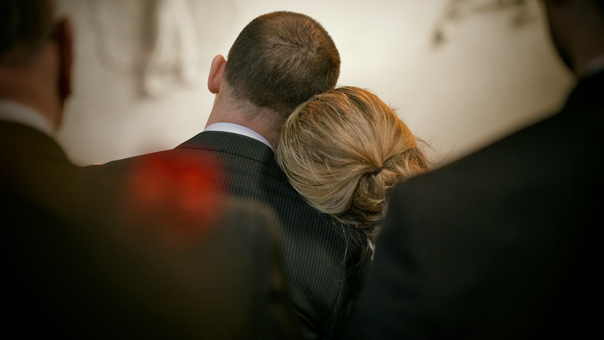 a man and a woman looking at the camera