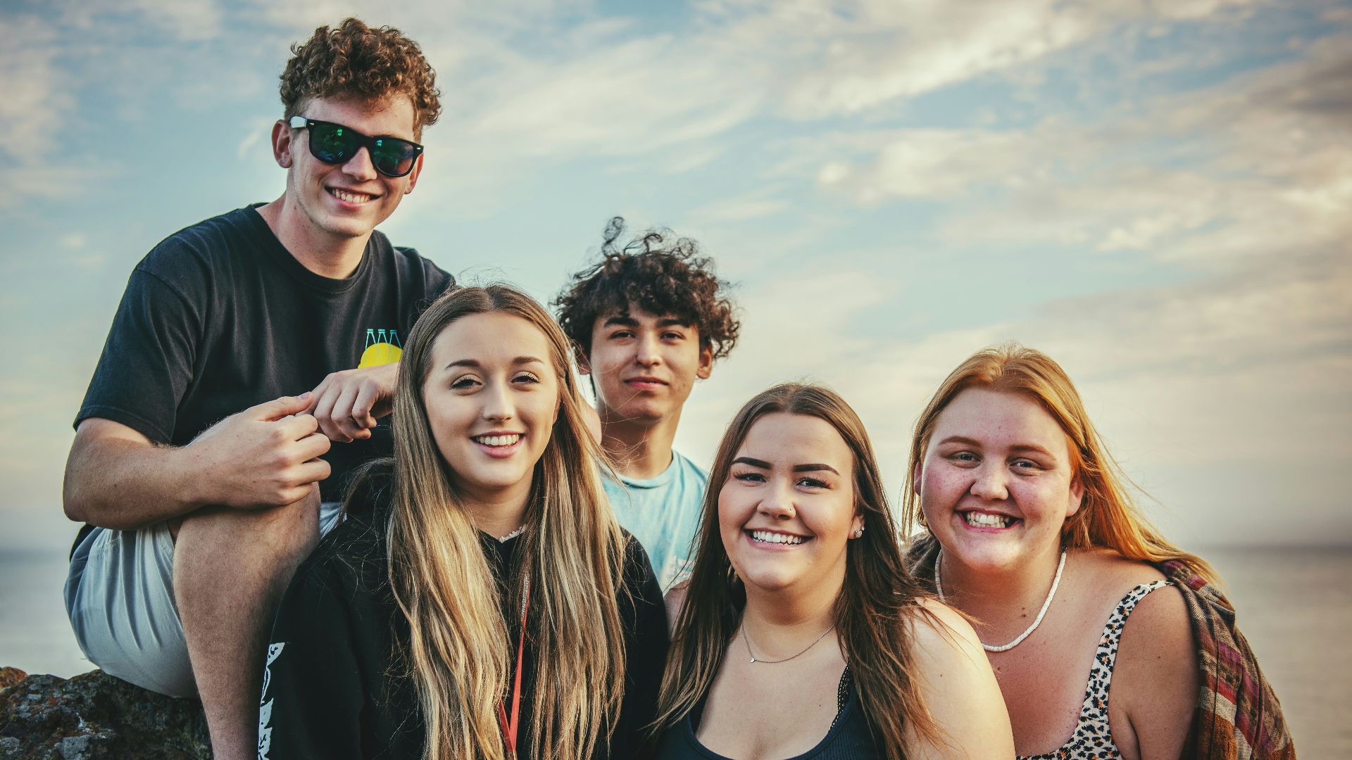 photography of five people near outdoor during daytime