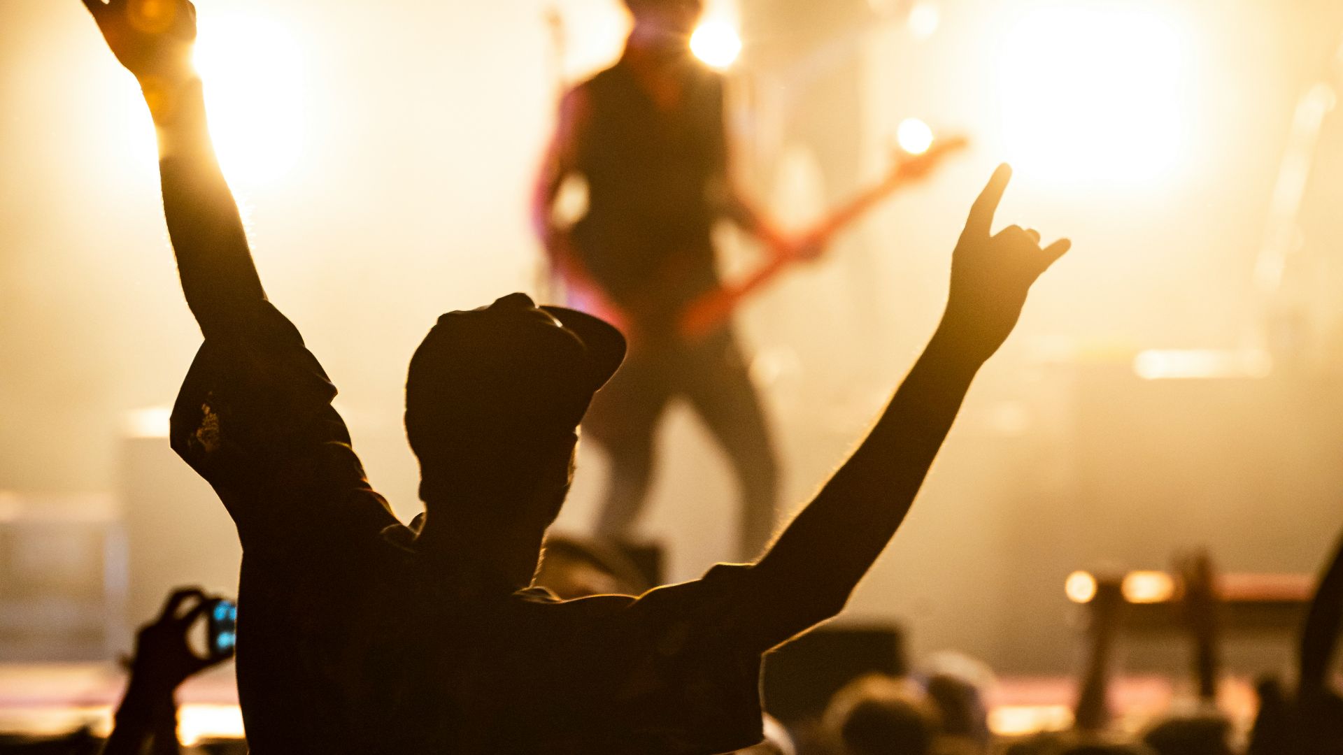 people watching band on the stage