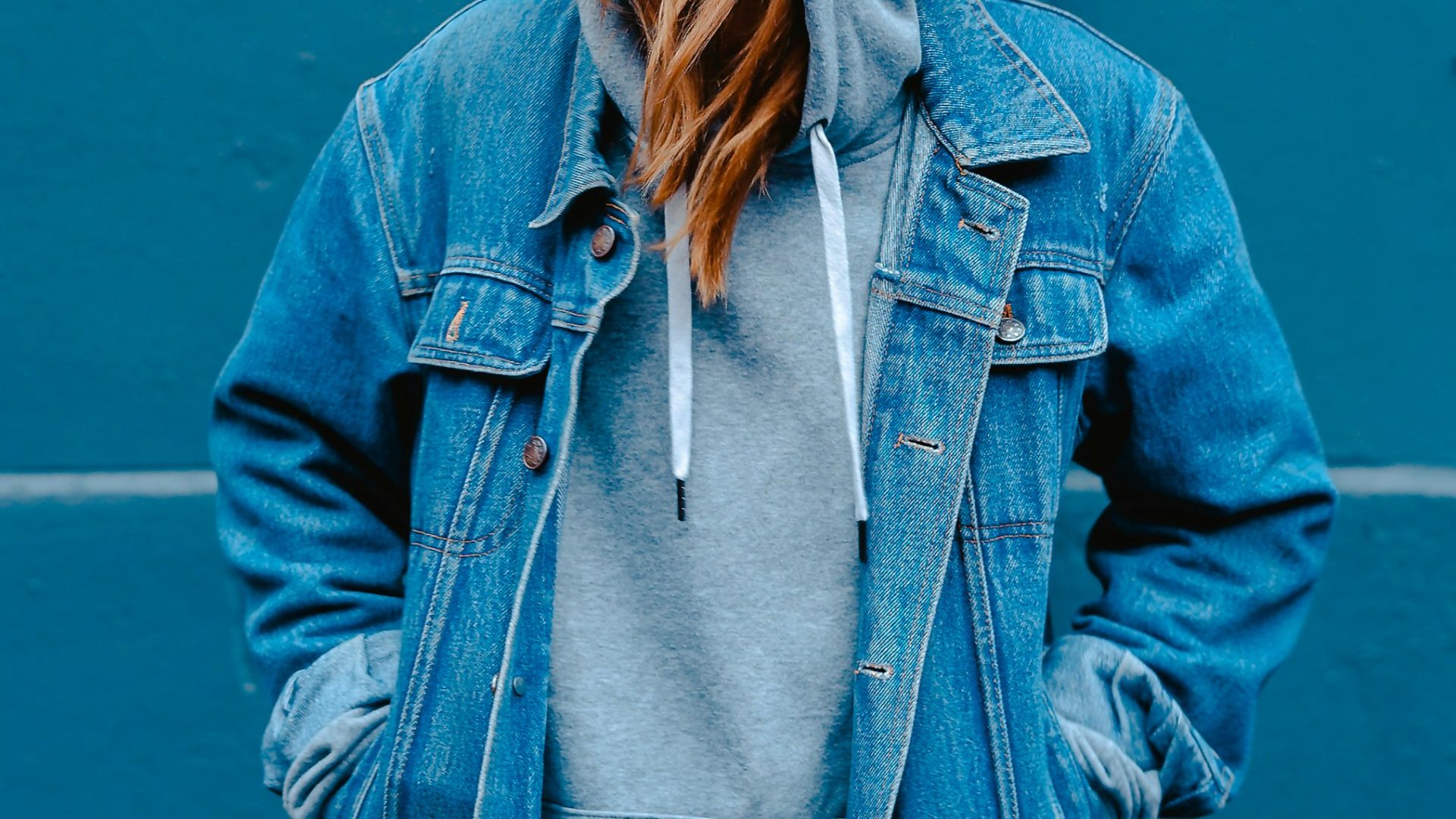 woman standing near blue steel gate