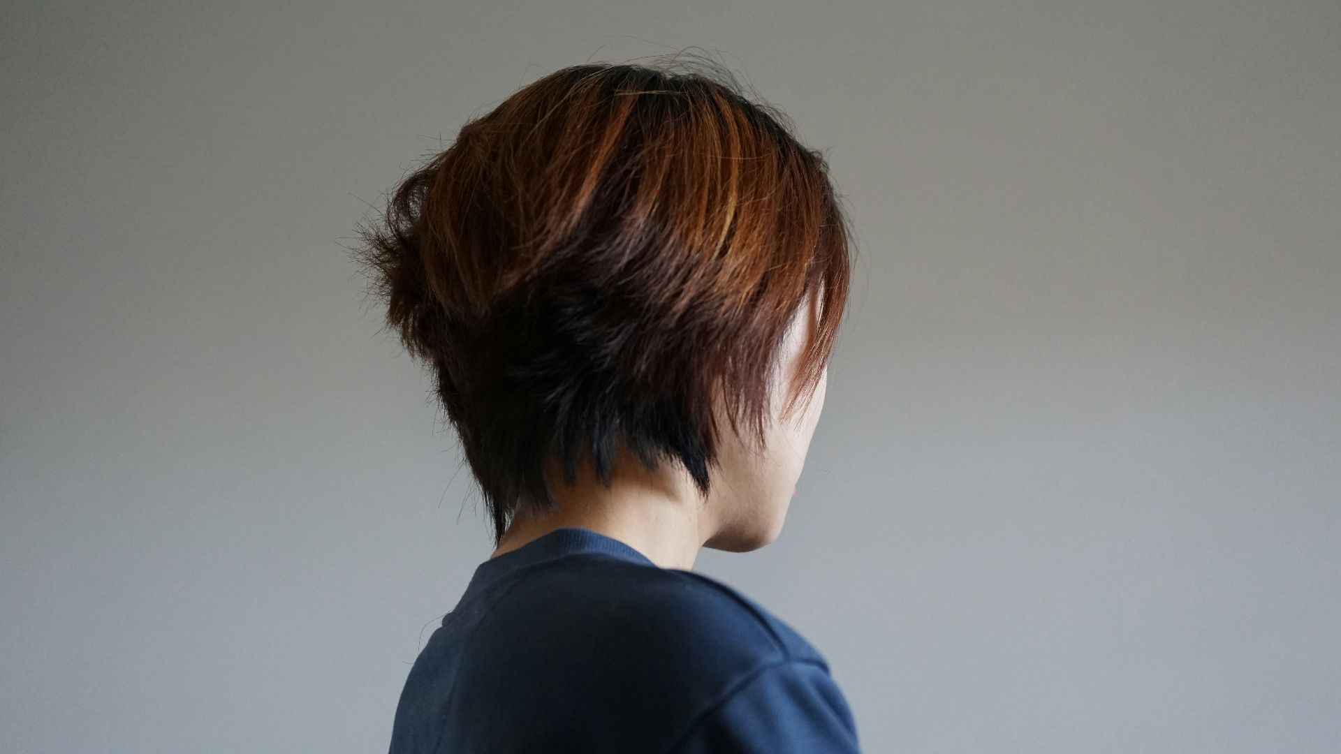 the back of a woman's head with short hair
