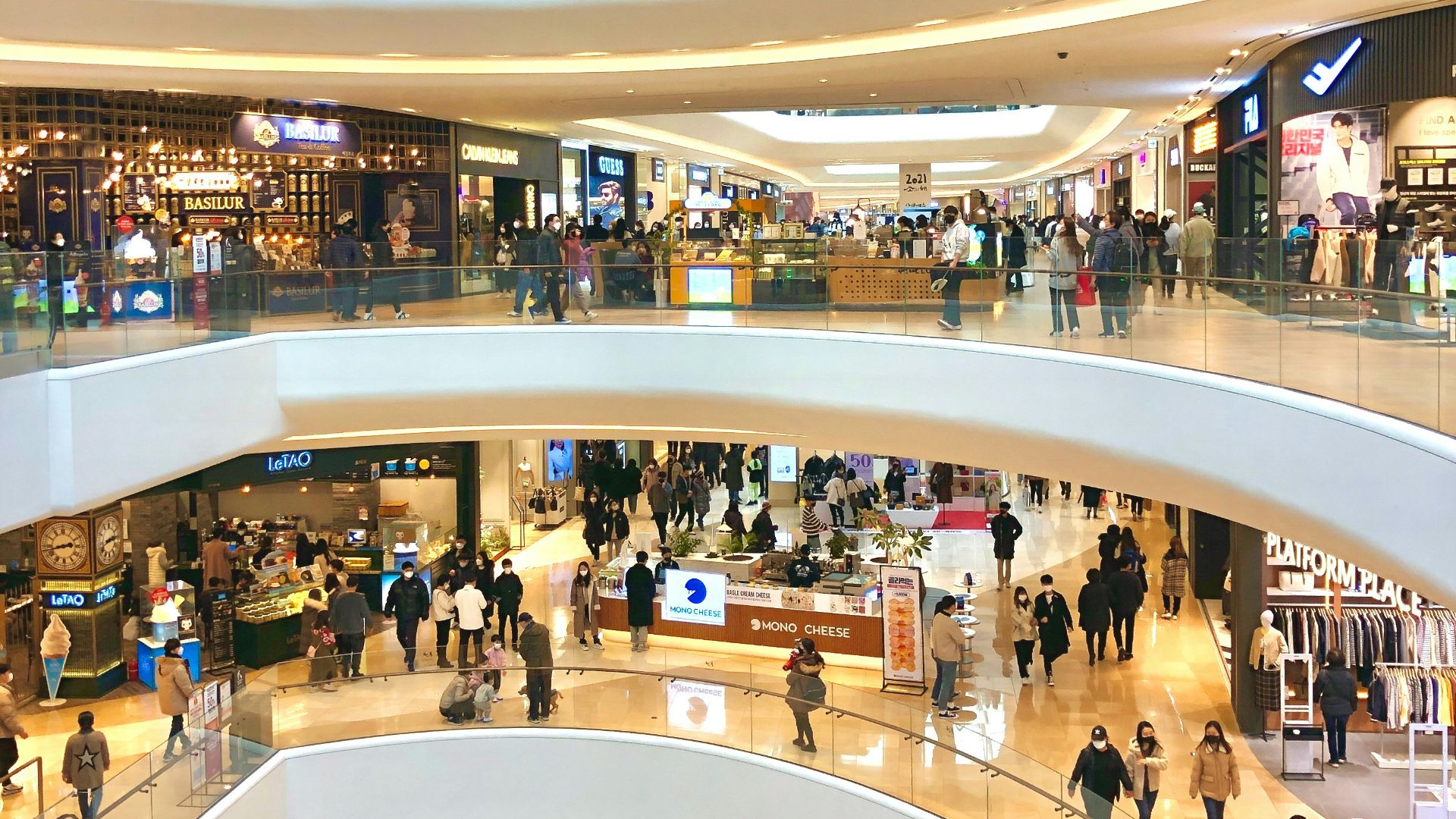 a mall filled with lots of people walking around