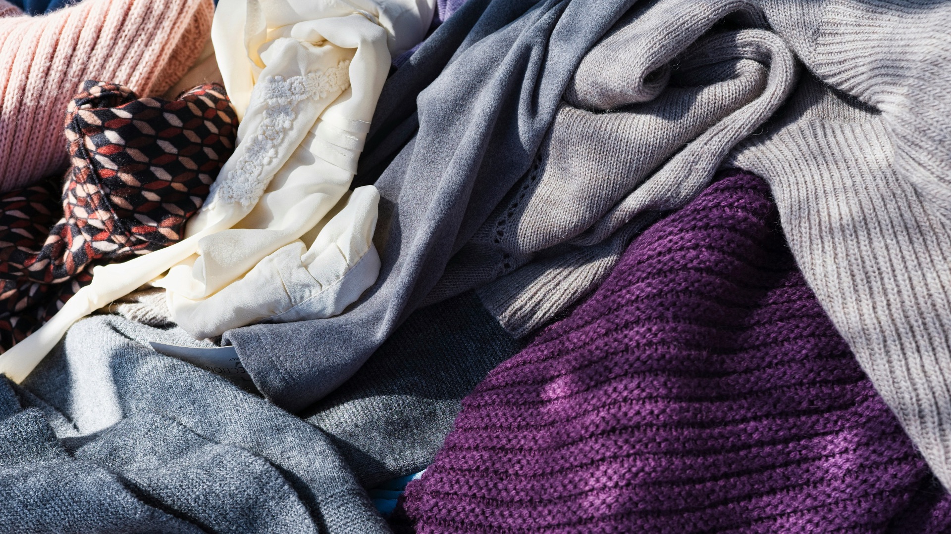 a pile of purple and white cloth