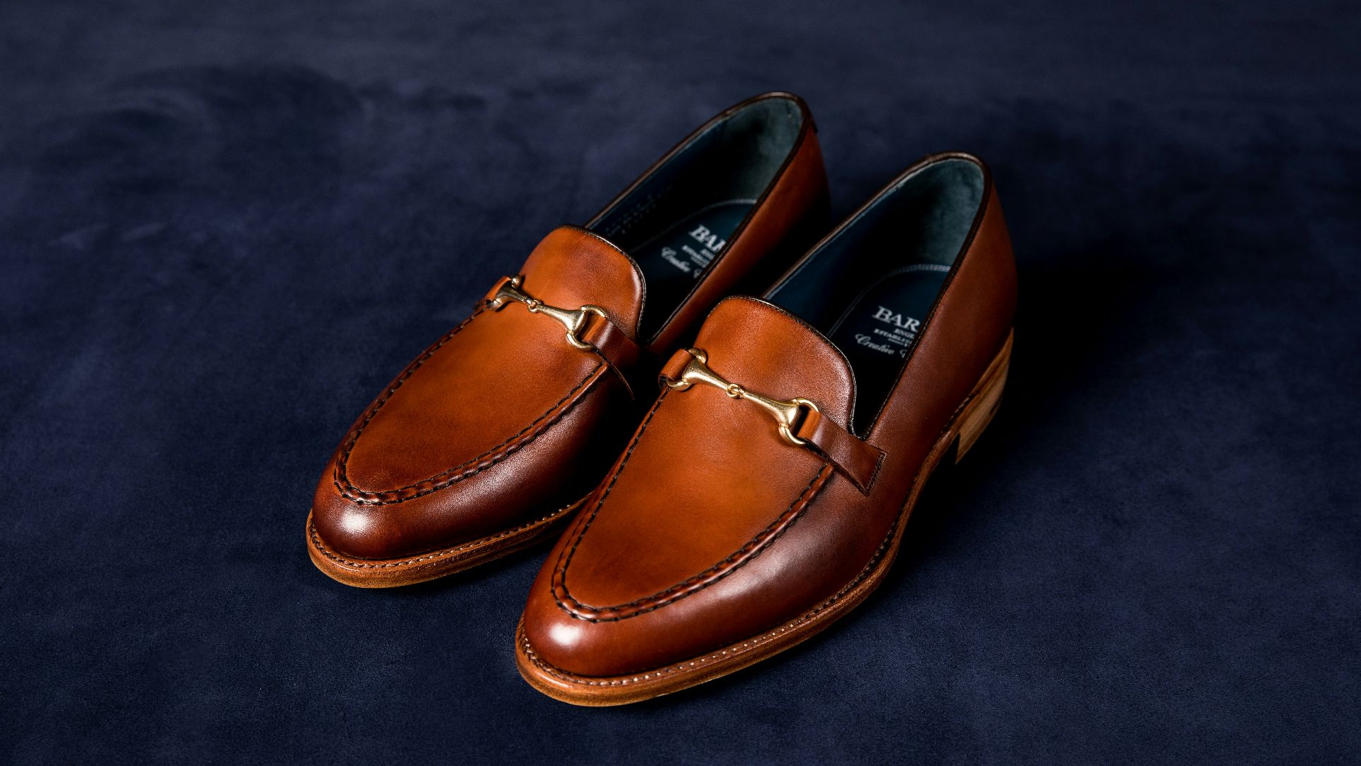 brown leather loafers on blue textile