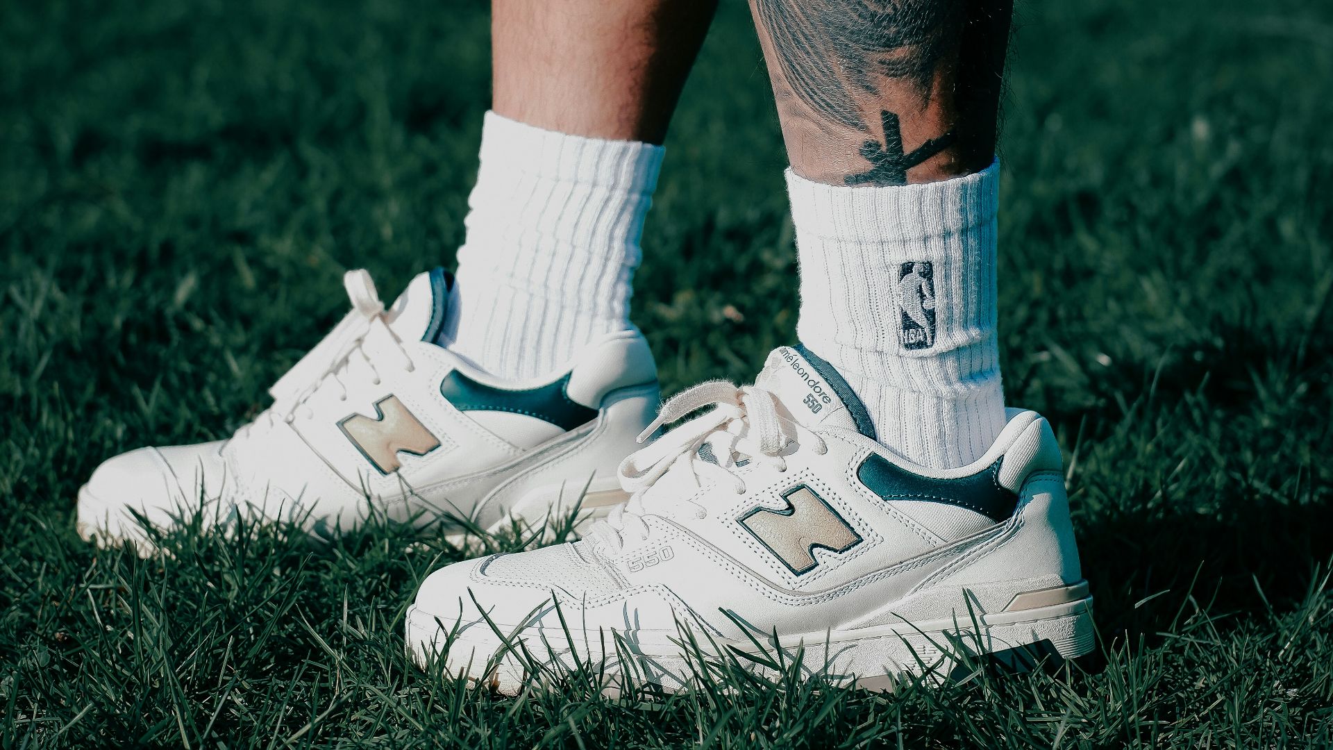 person wearing white nike athletic shoes