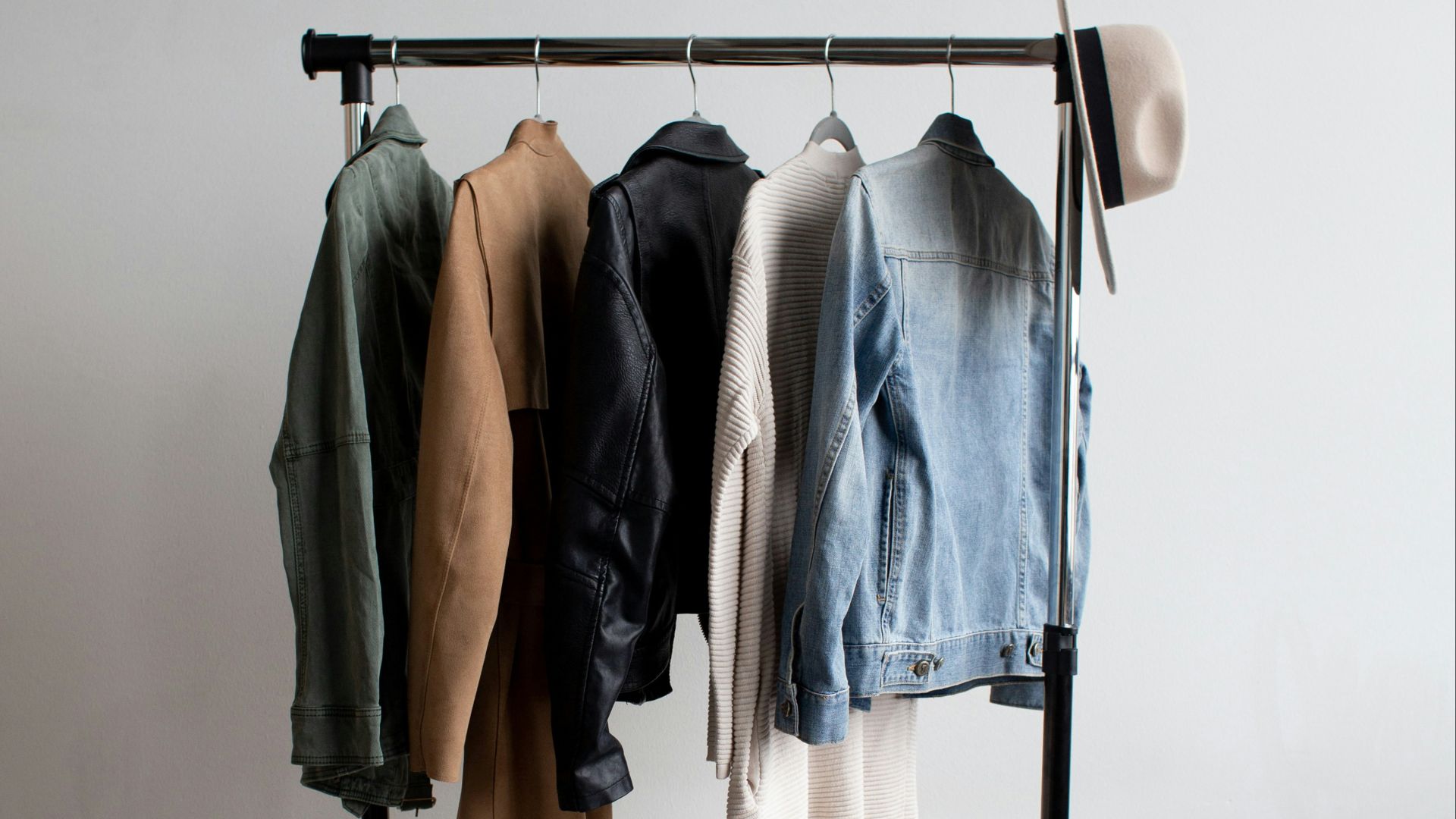 five jackets on clothes rack