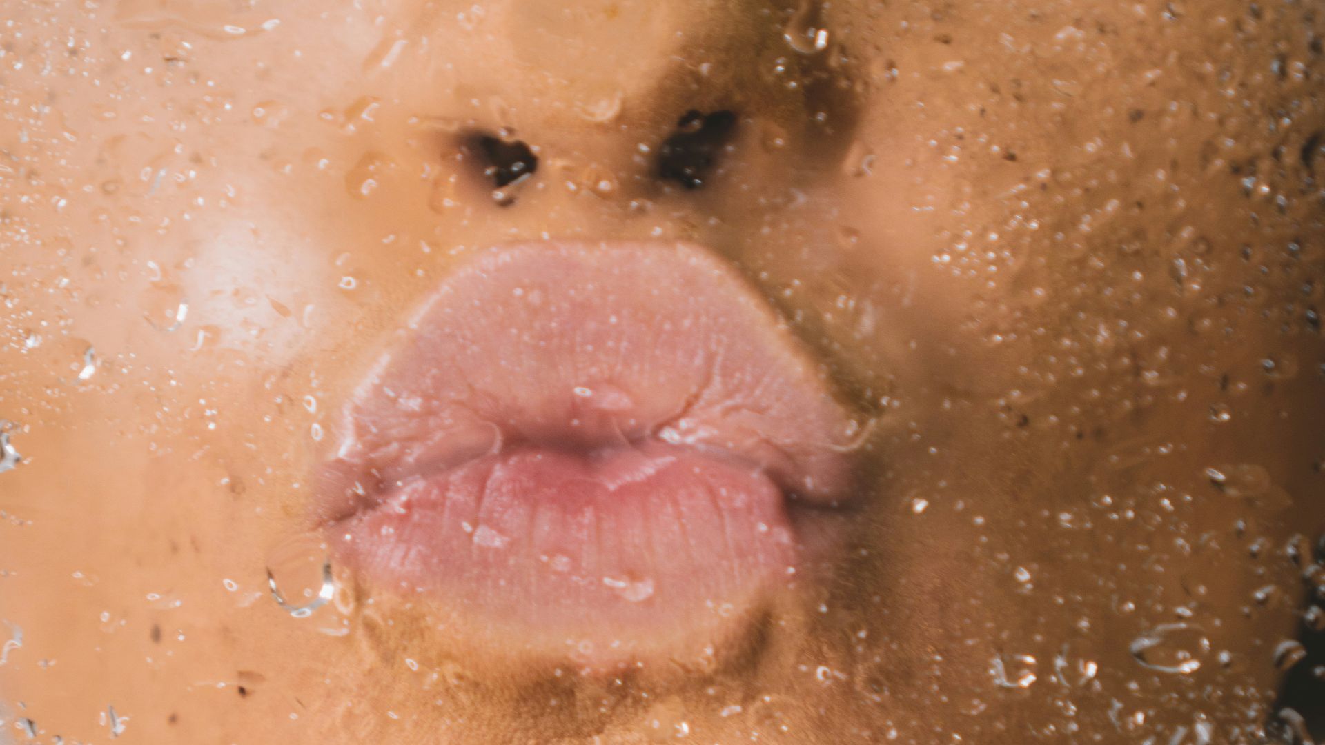 woman in water with water droplets