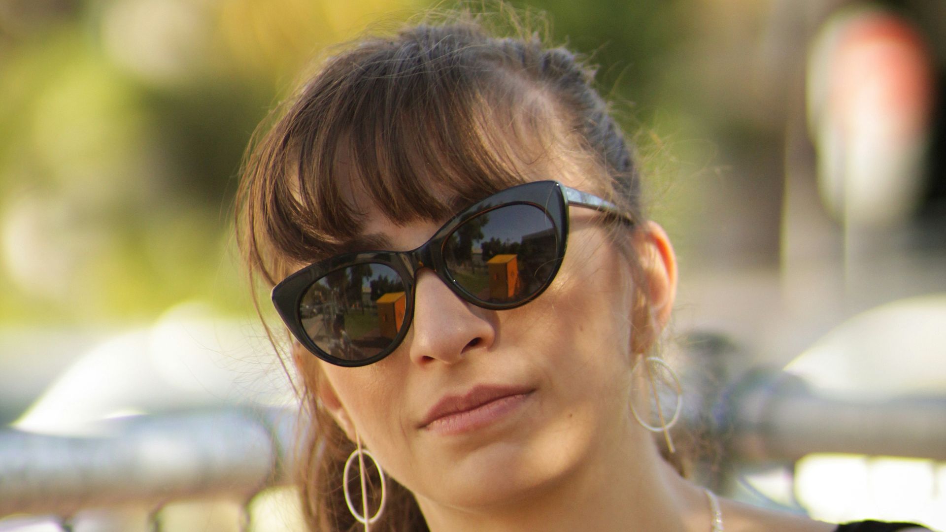 woman wearing silver-colored necklace