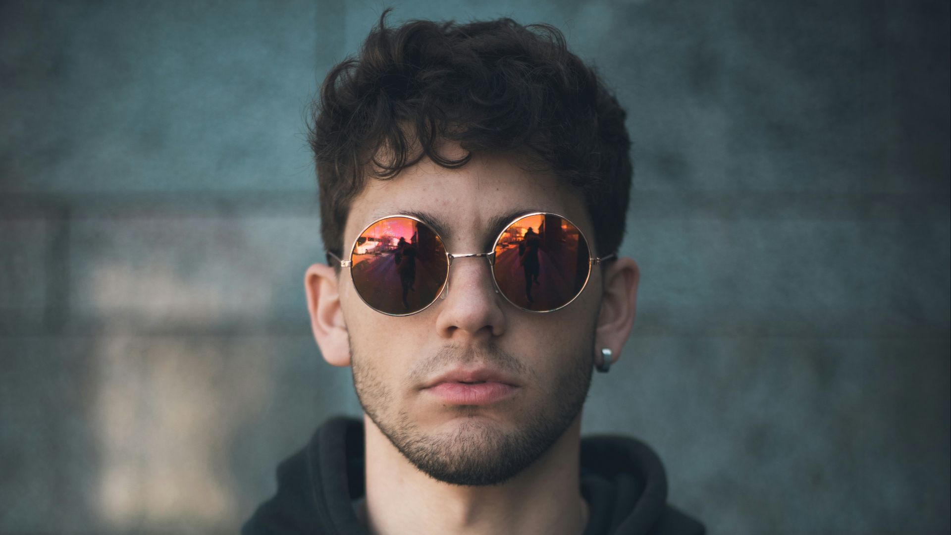 man standing wearing black Nike hoodie
