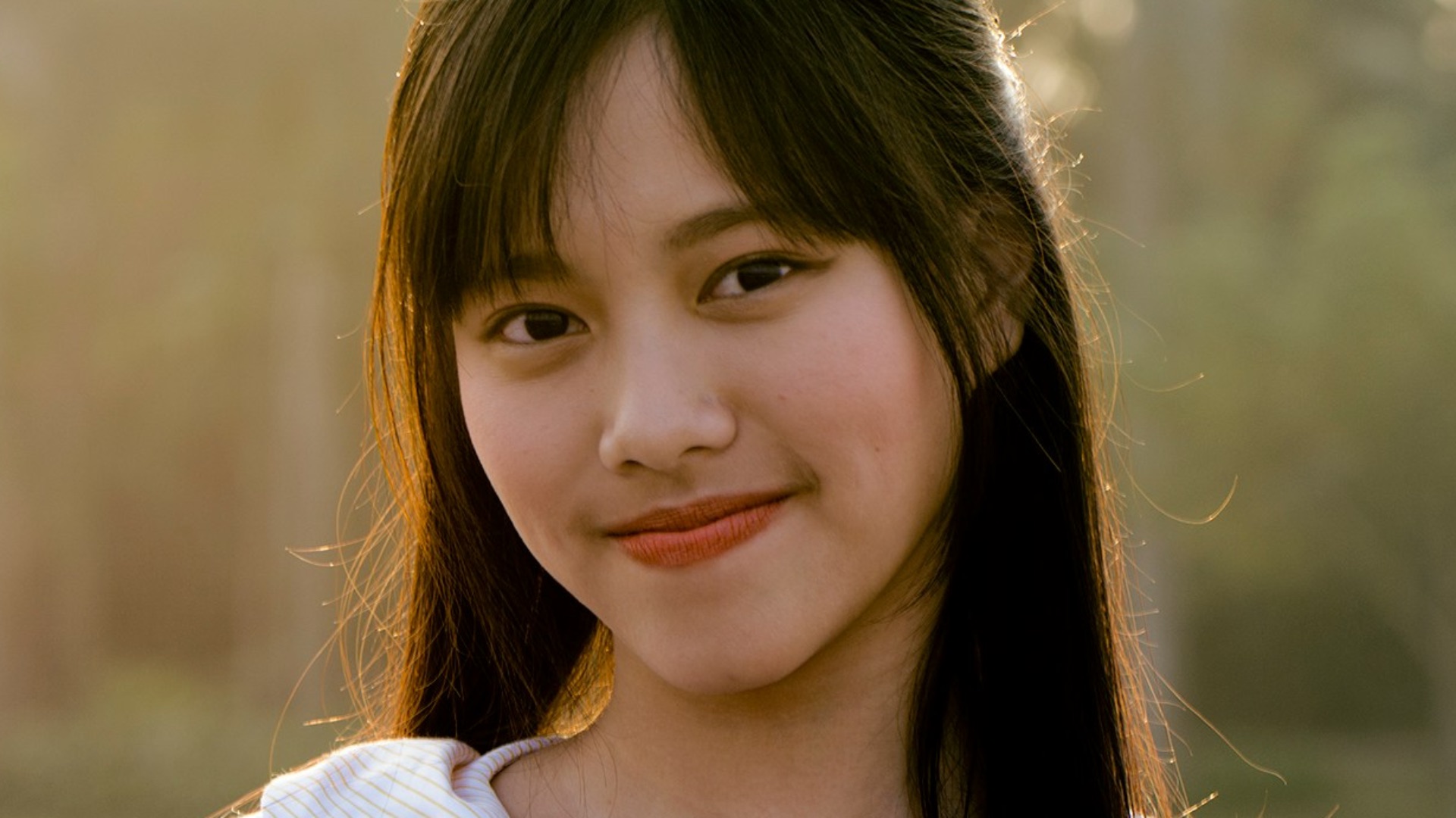 woman in white striped top