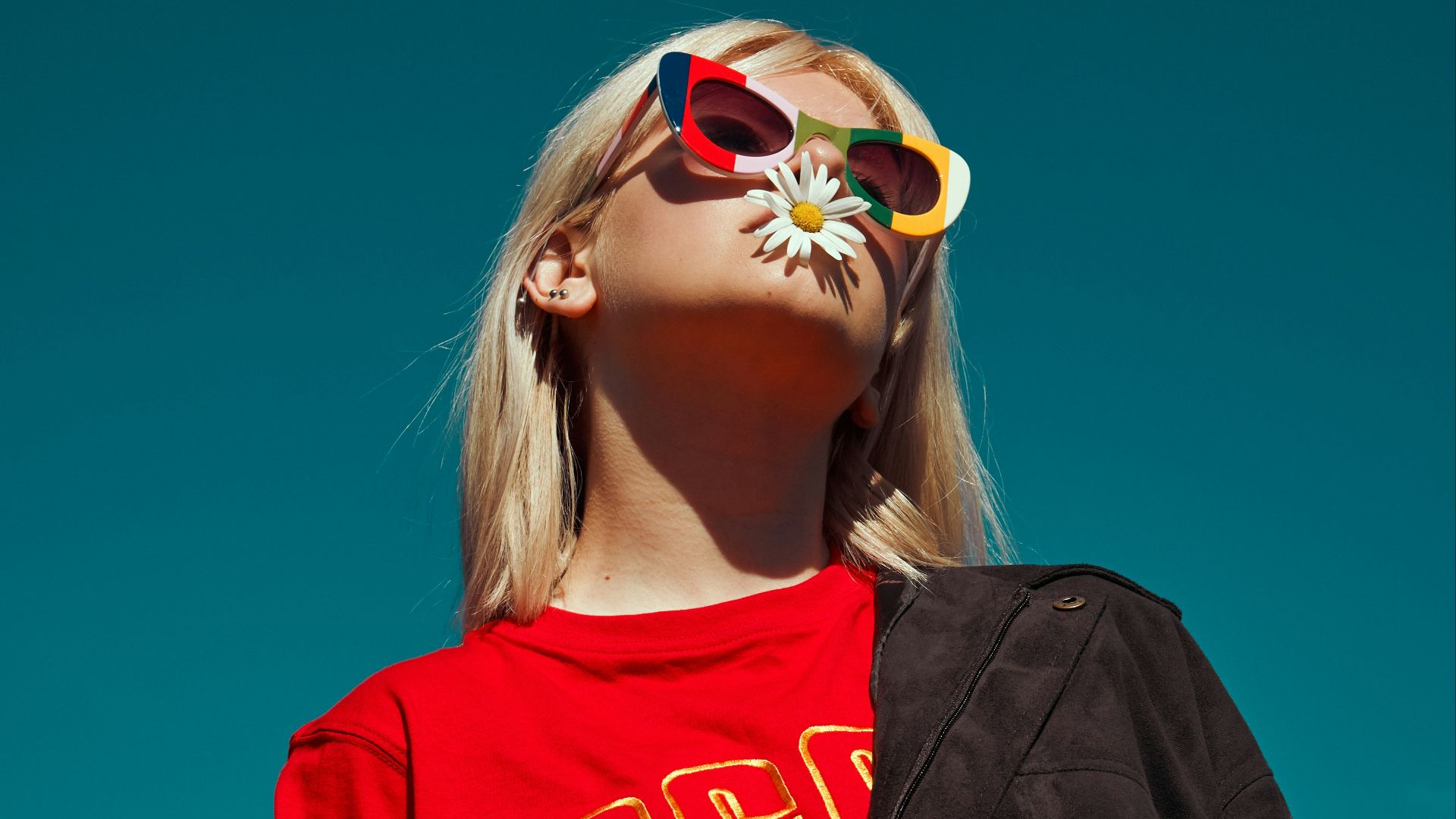 woman with sunglasses standing outdoor during daytime