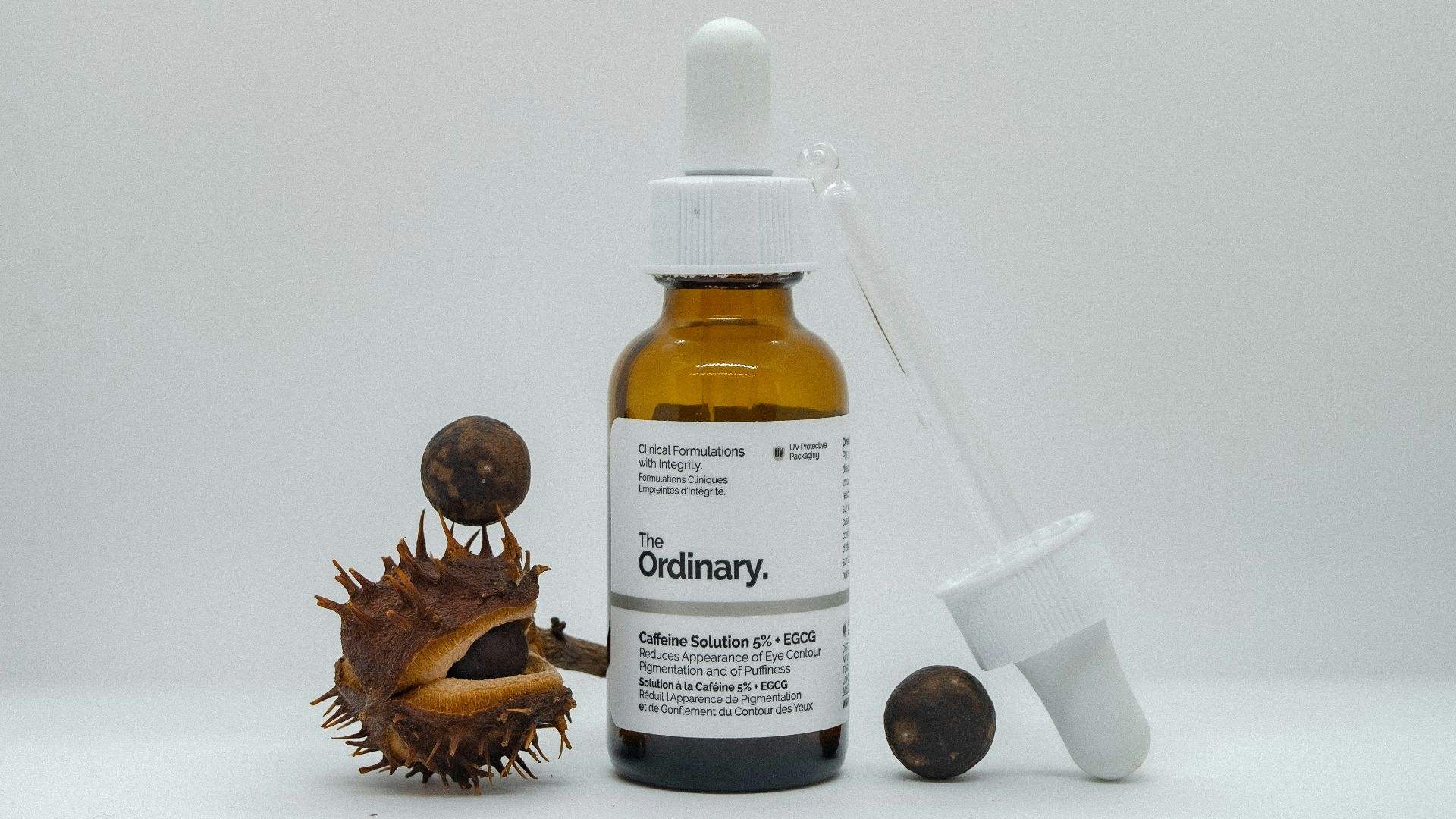 a bottle of alcohol next to a small figurine