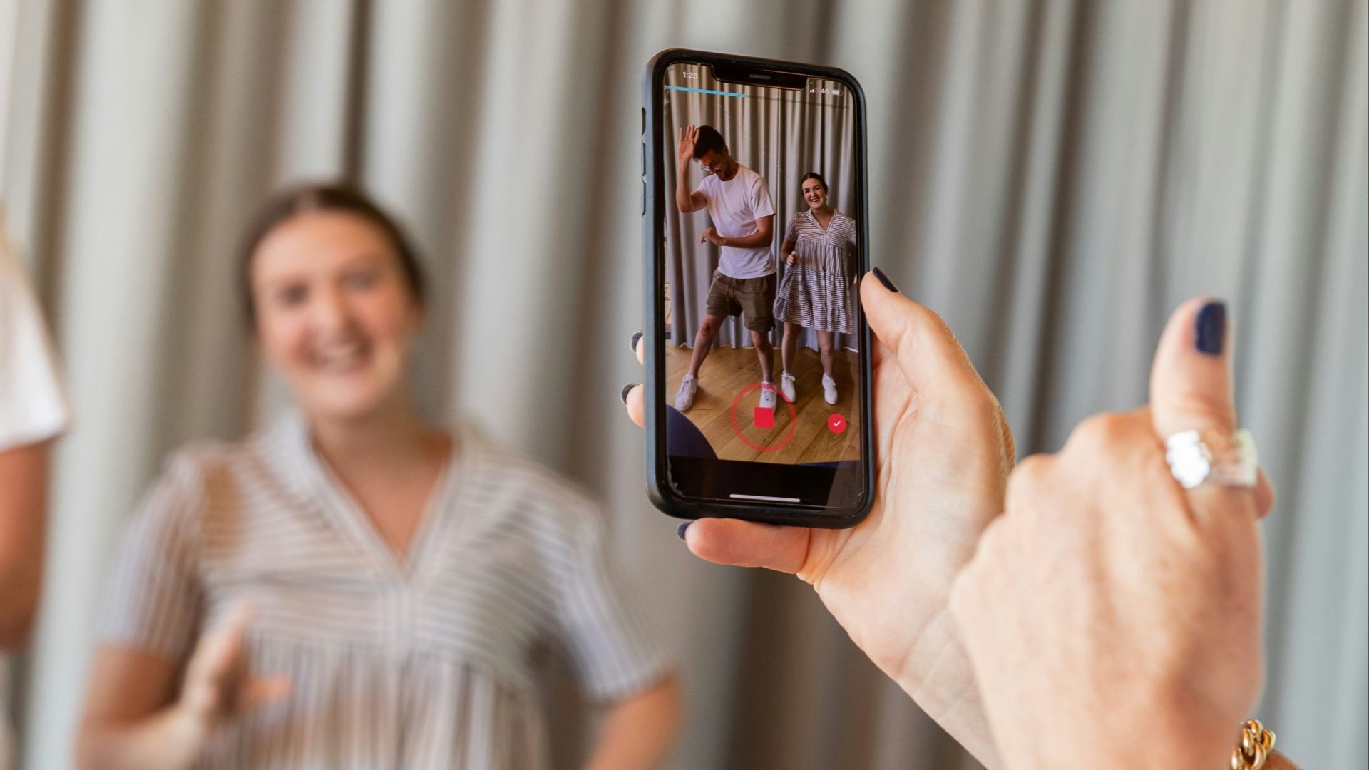 a woman holding a picture of a man