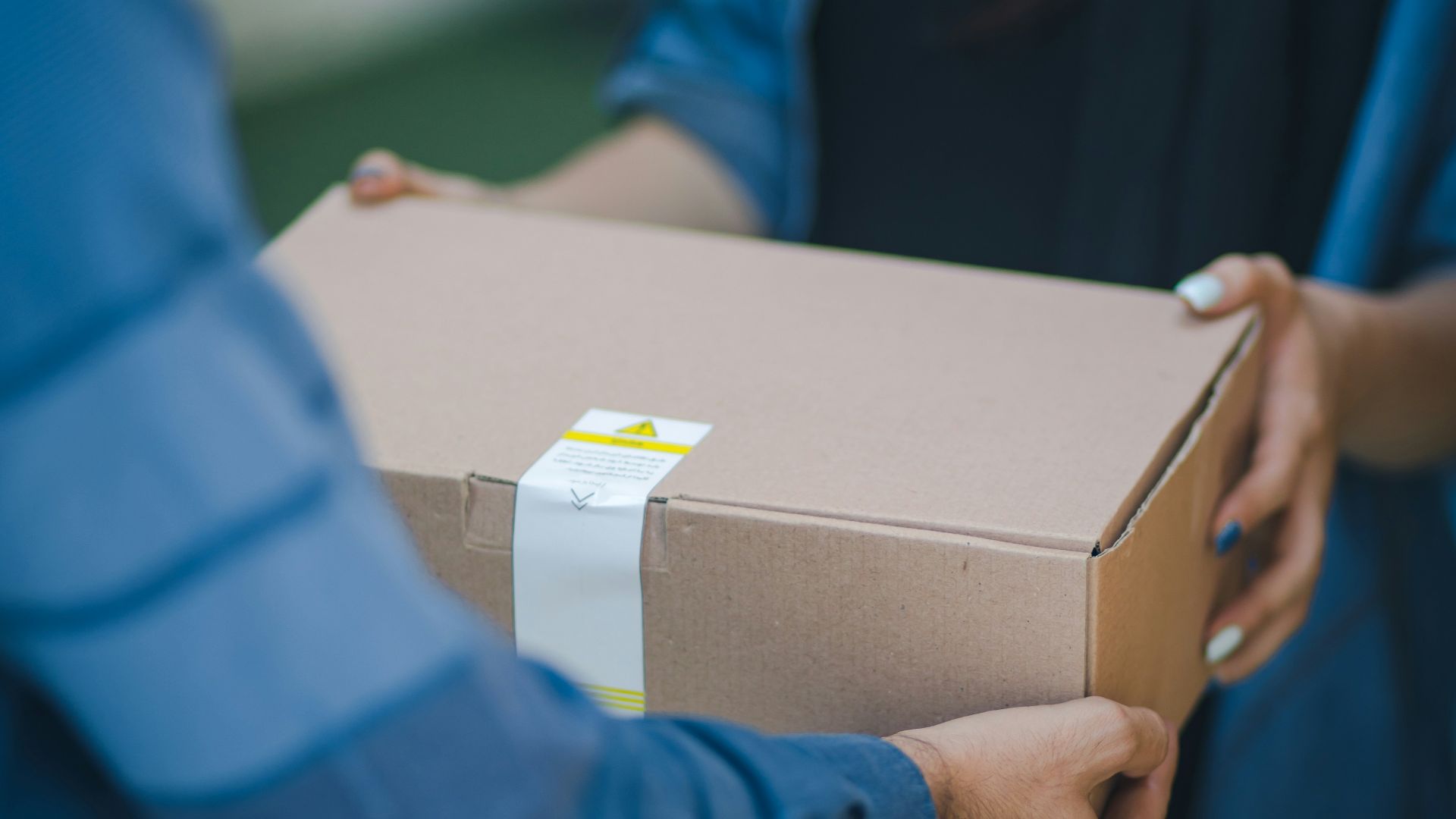 person giving brown box