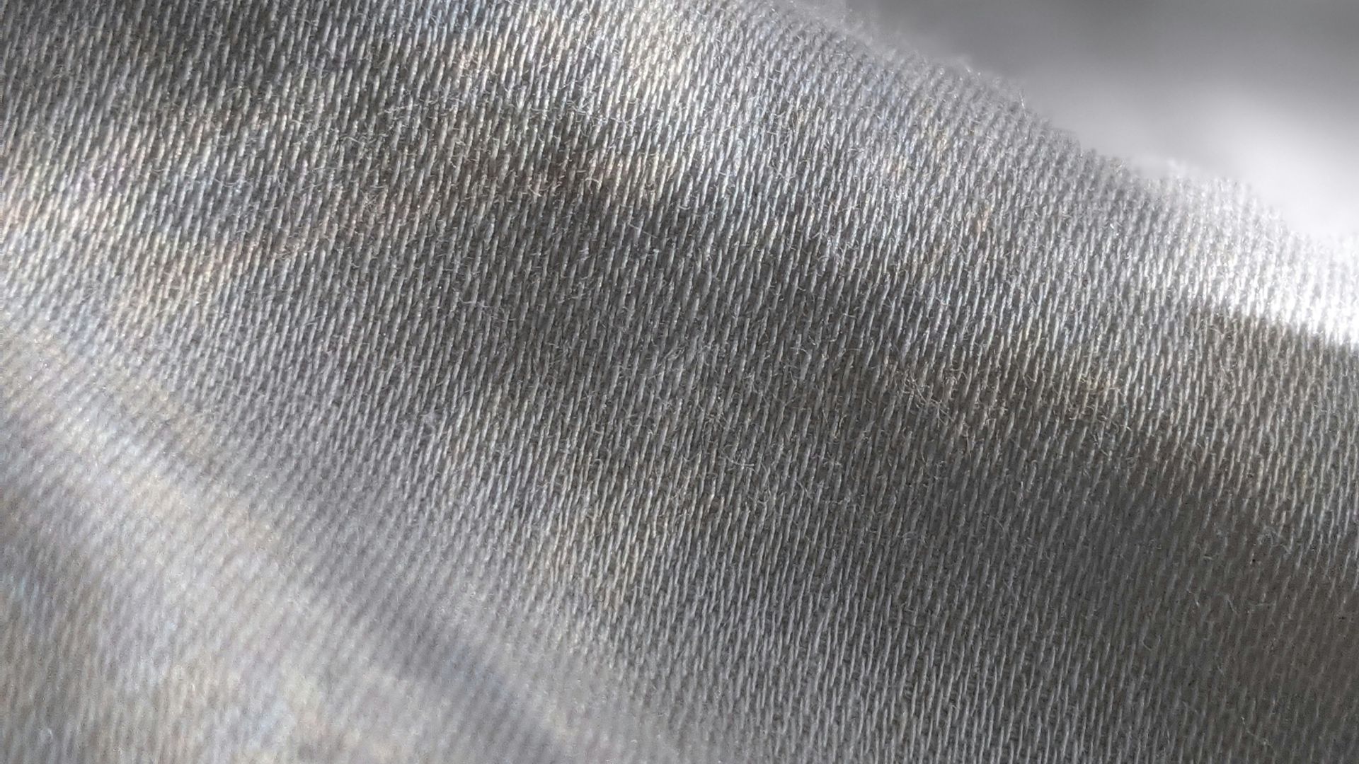 a close up of a gray fabric with a blurry background