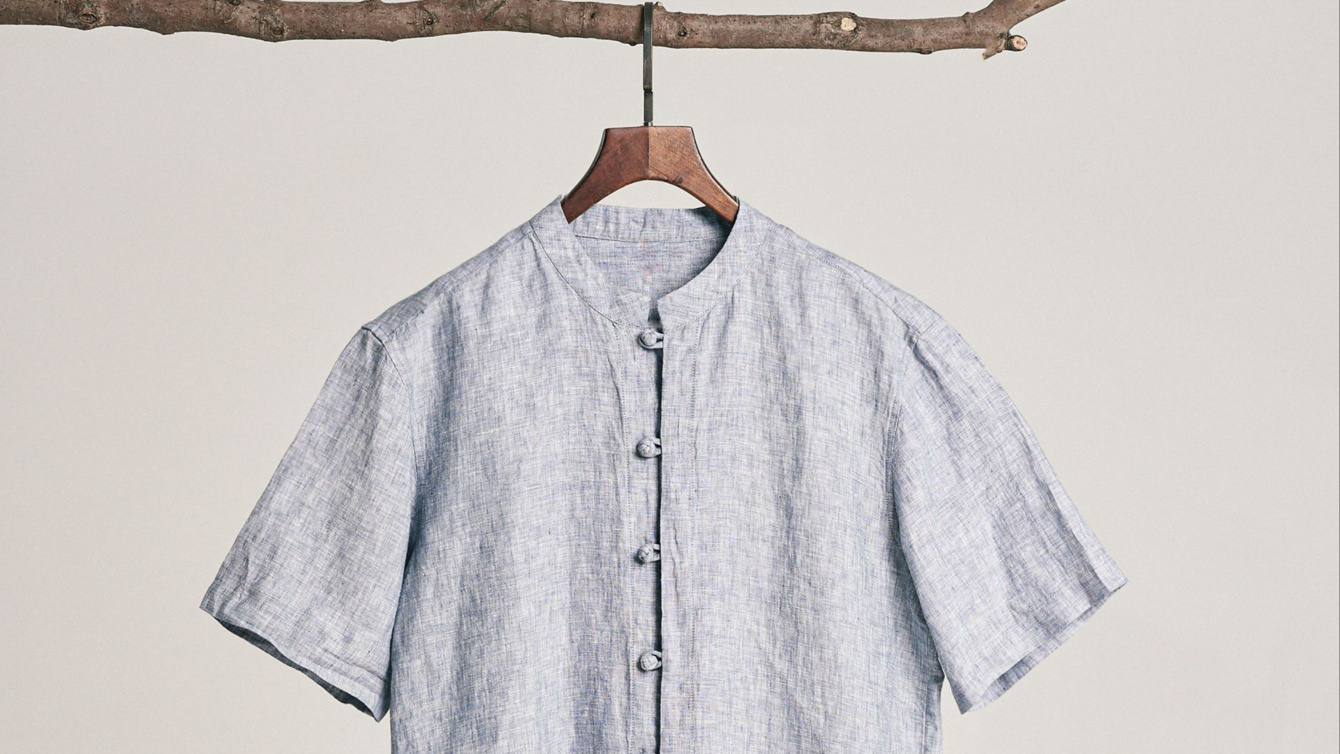 a blue shirt hanging on a clothes line