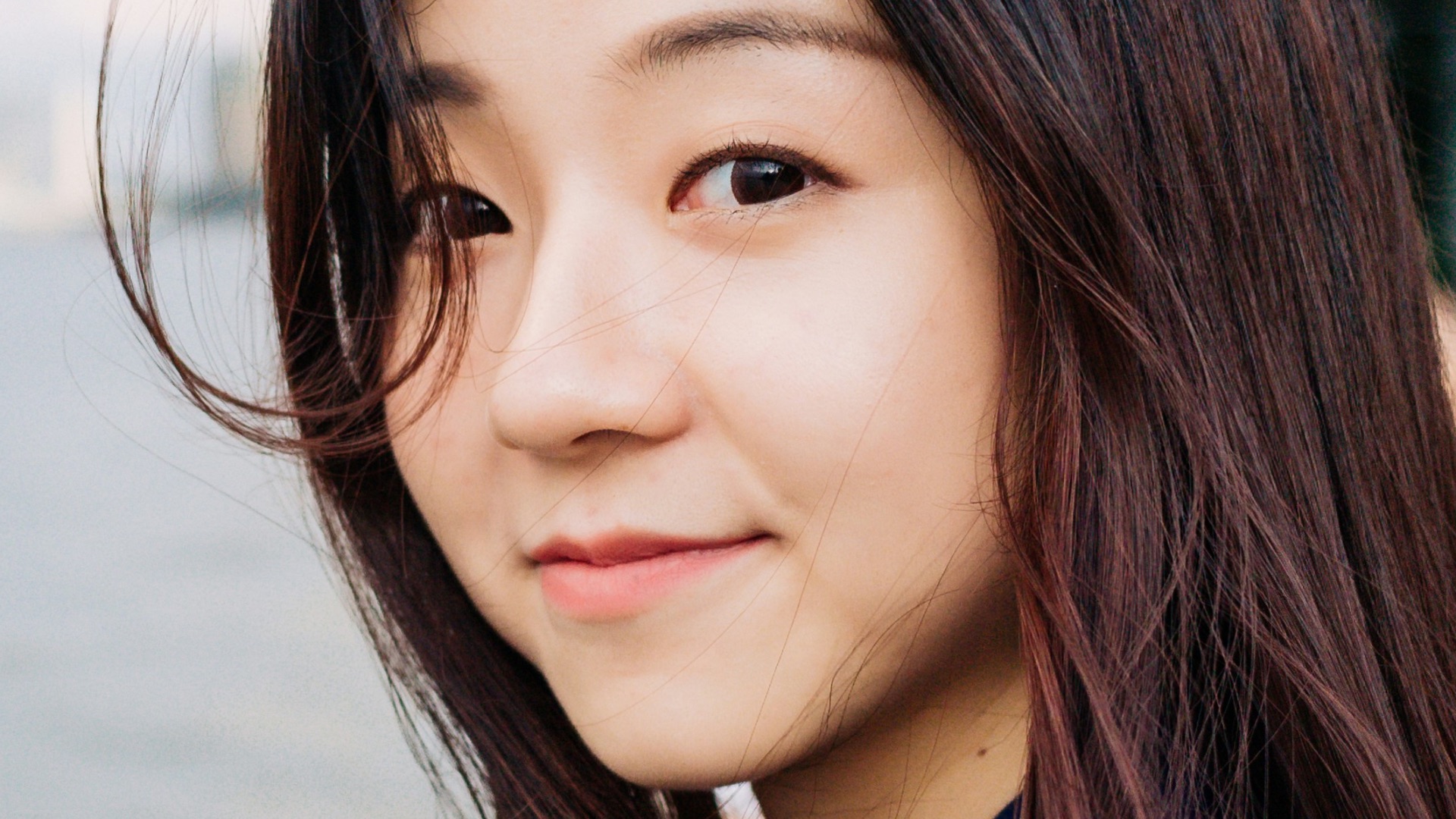 woman standing near body of water