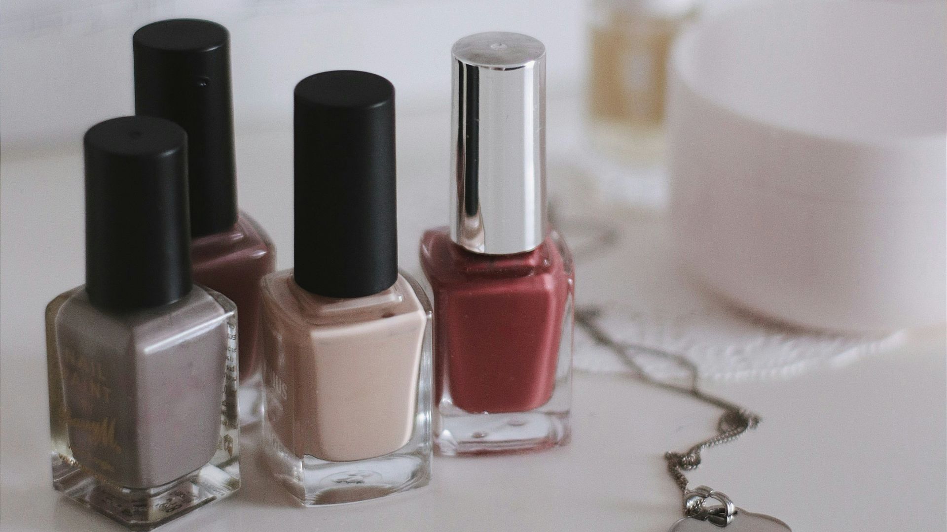 pink and black nail polish bottles