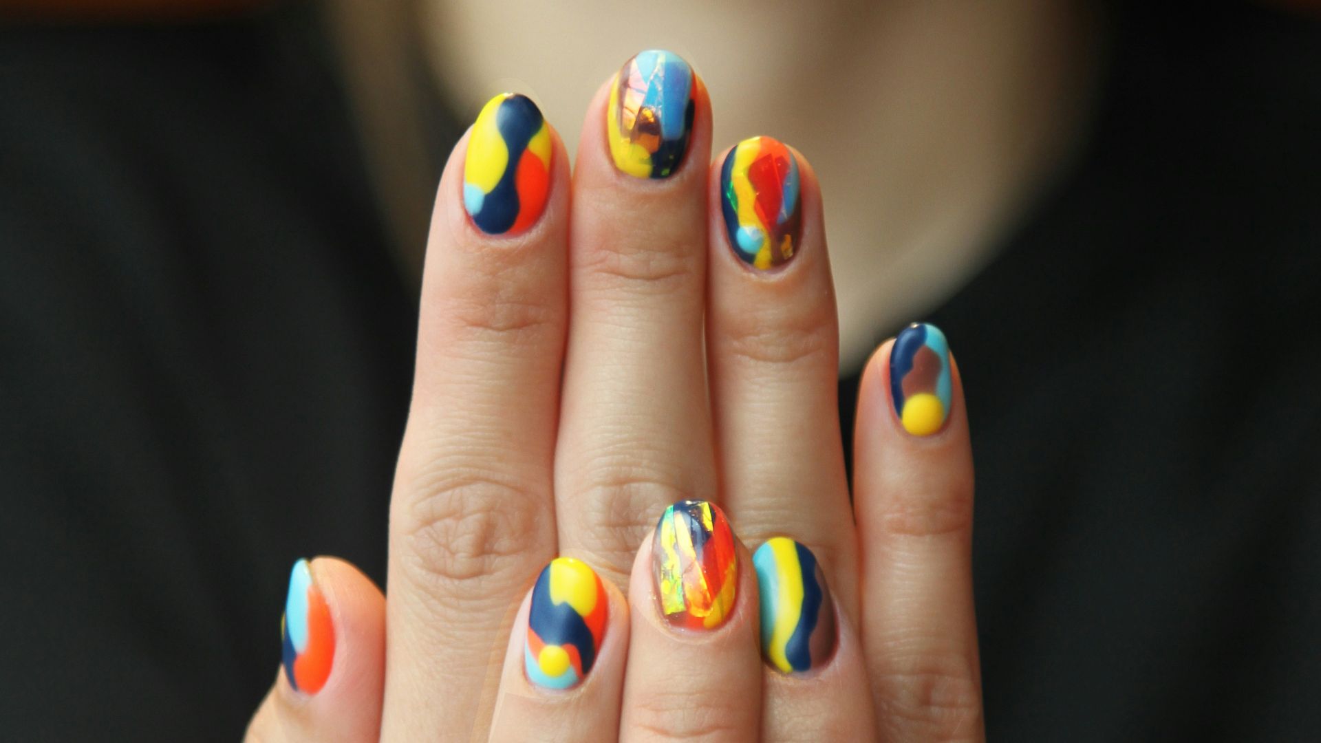 woman's nails with manicure