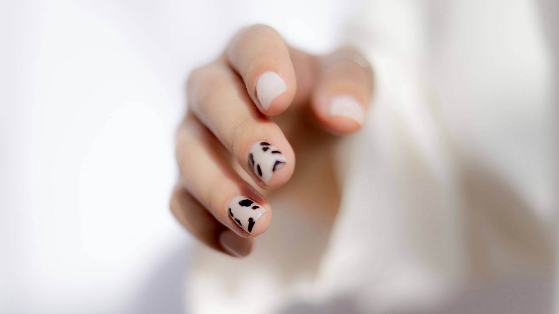 a hand with painted nails