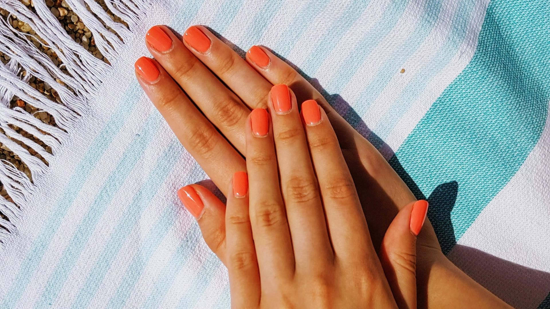 person's hands putting on towel