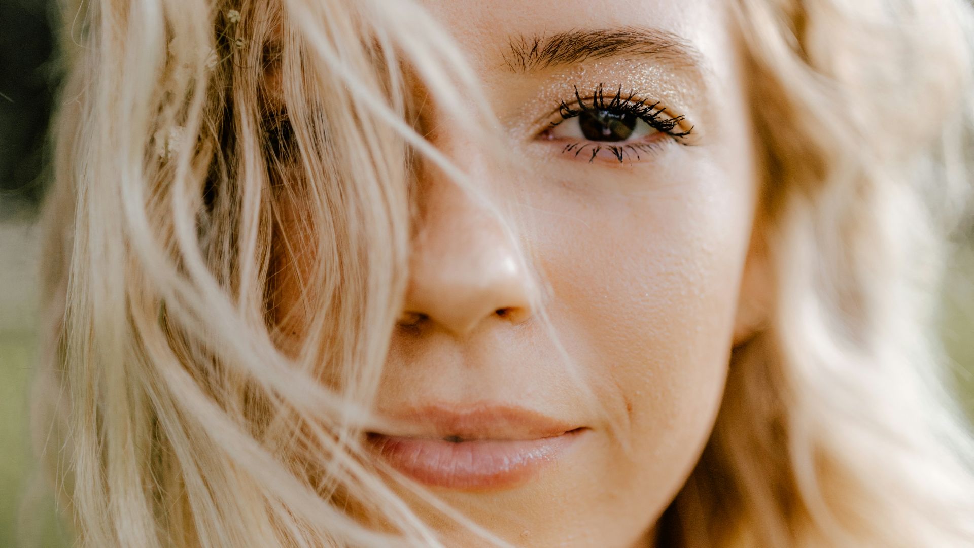 woman with blonde hair and brown eyes