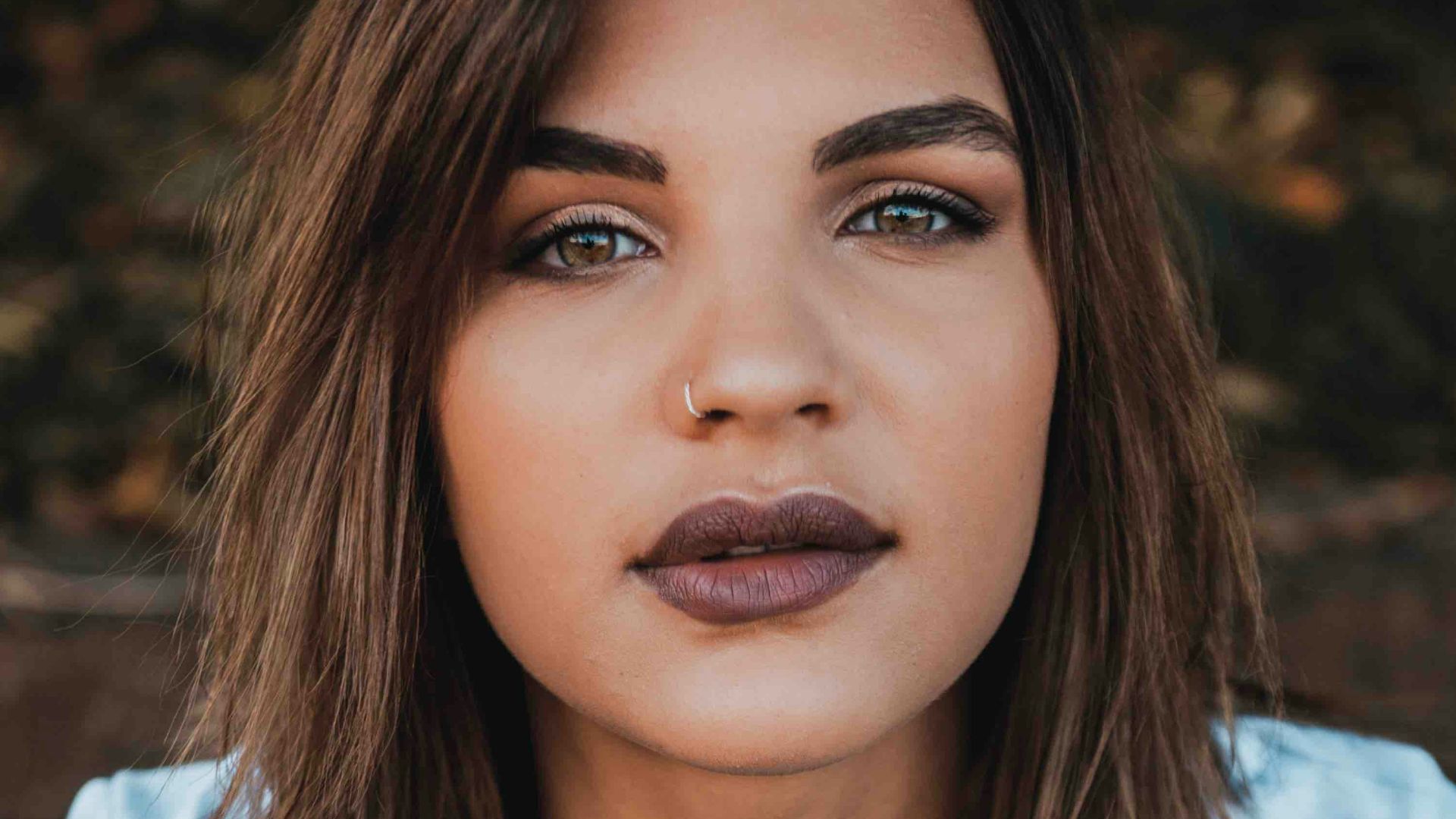 woman in white Vogue t-shirt and blue jeans