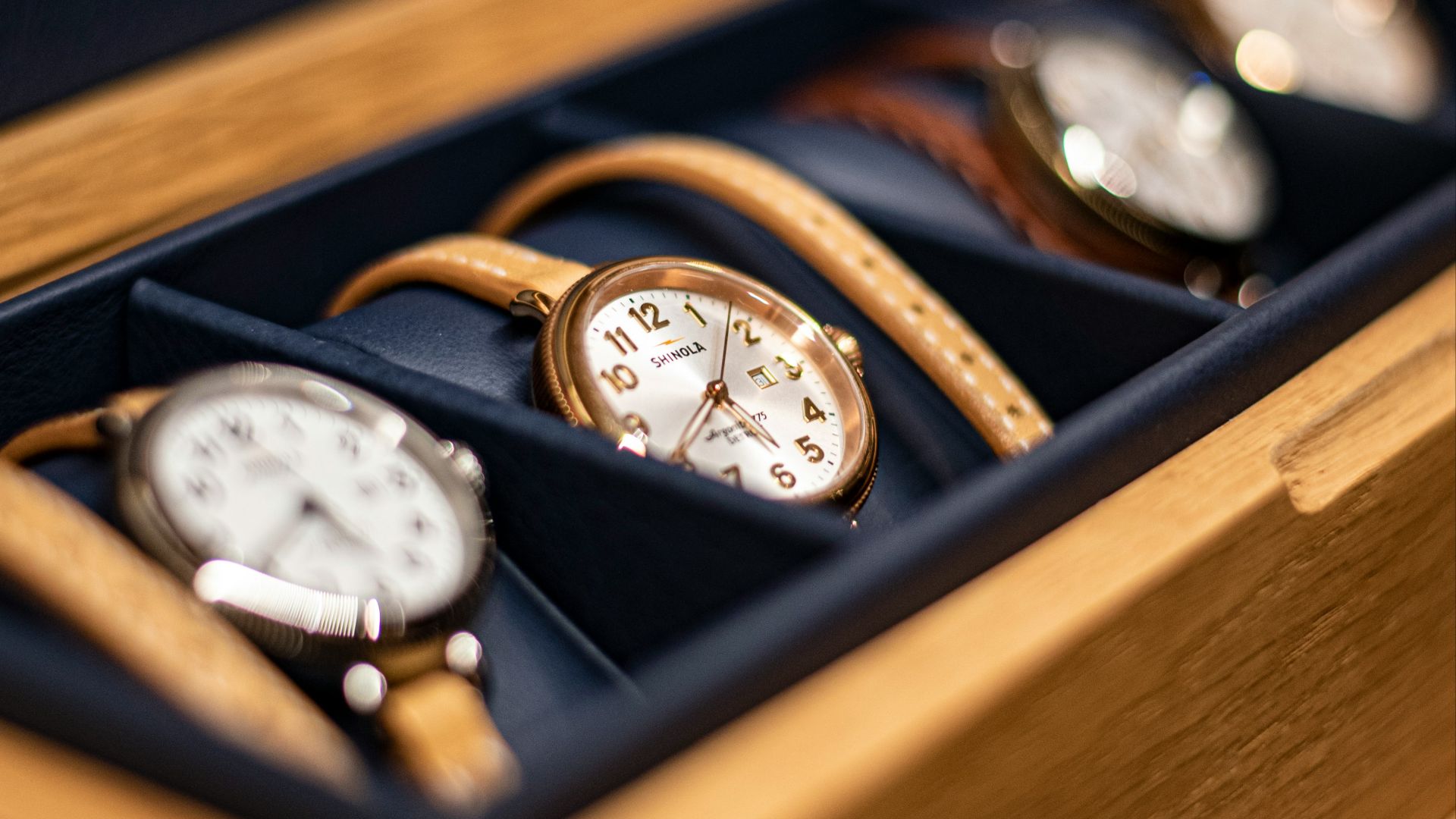 gold and white analog watch