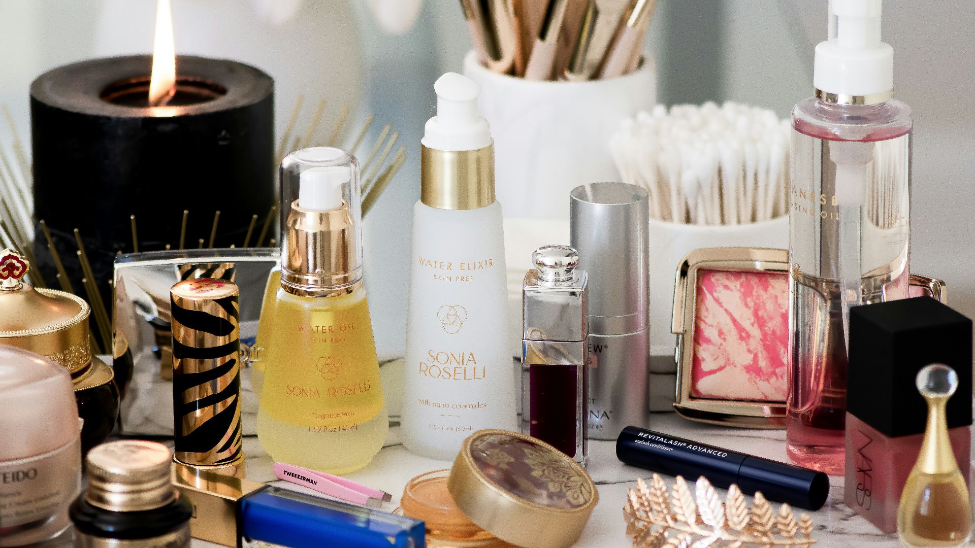 white and gold perfume bottle