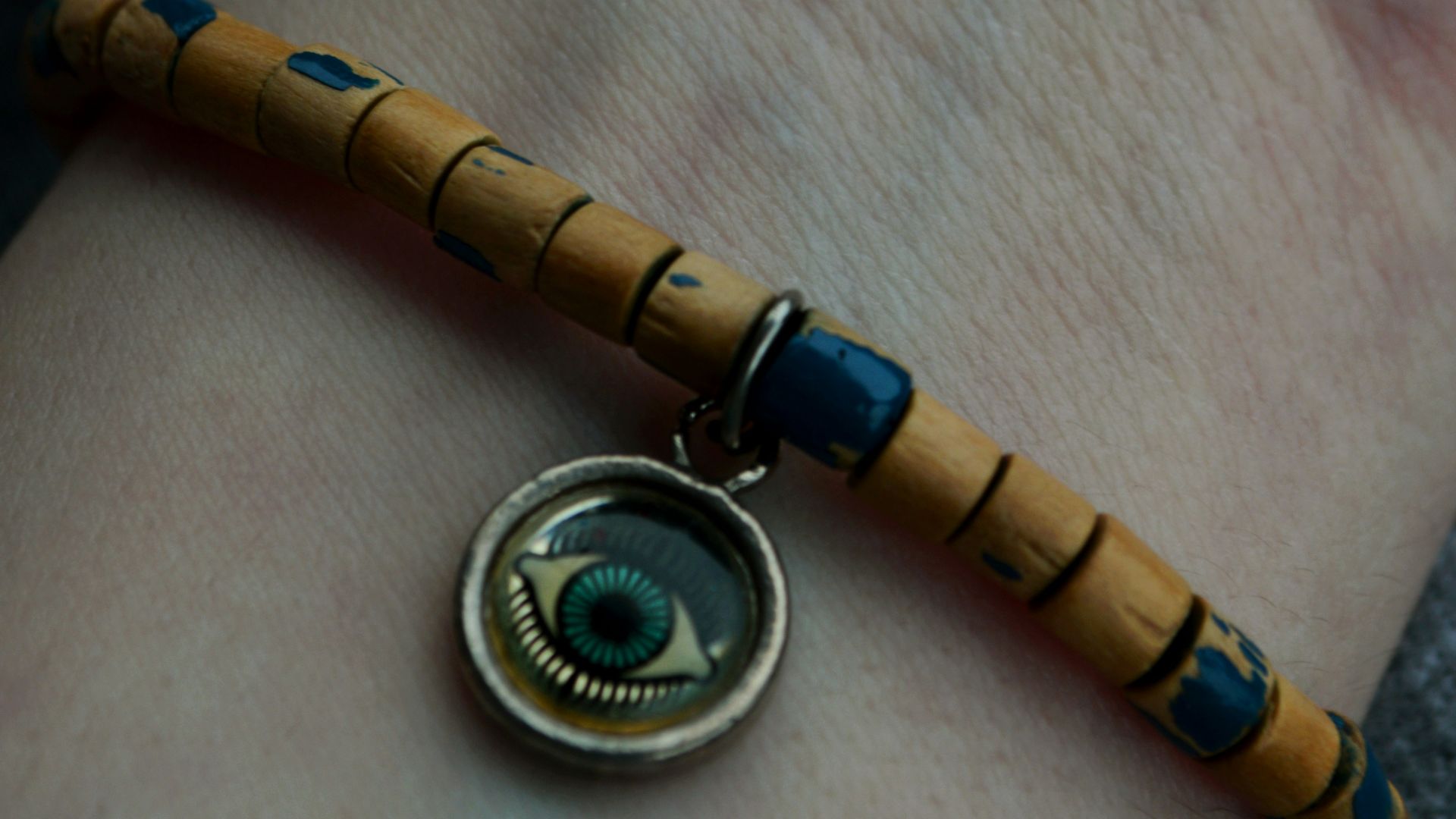 a person's arm with a bracelet on it