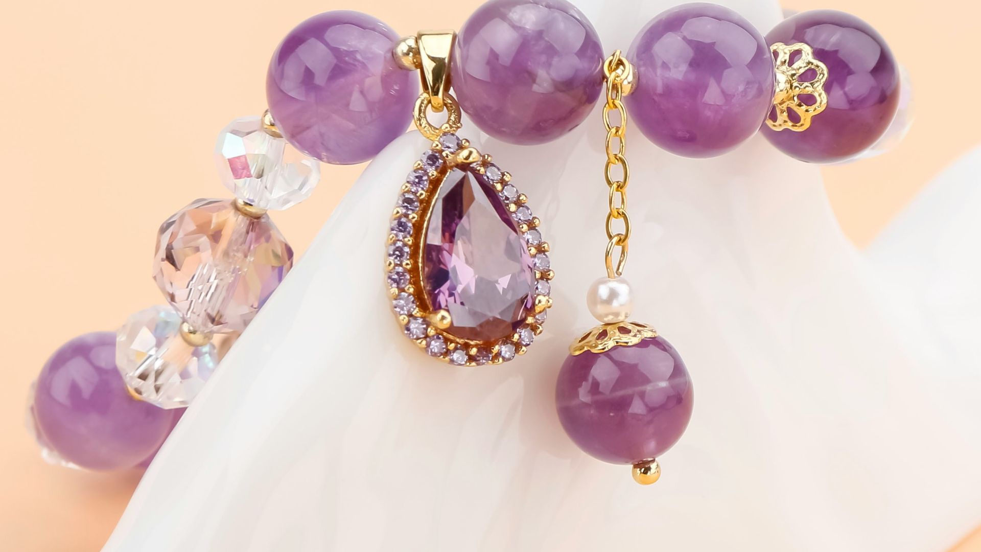 A beautiful purple bead bracelet with charm.