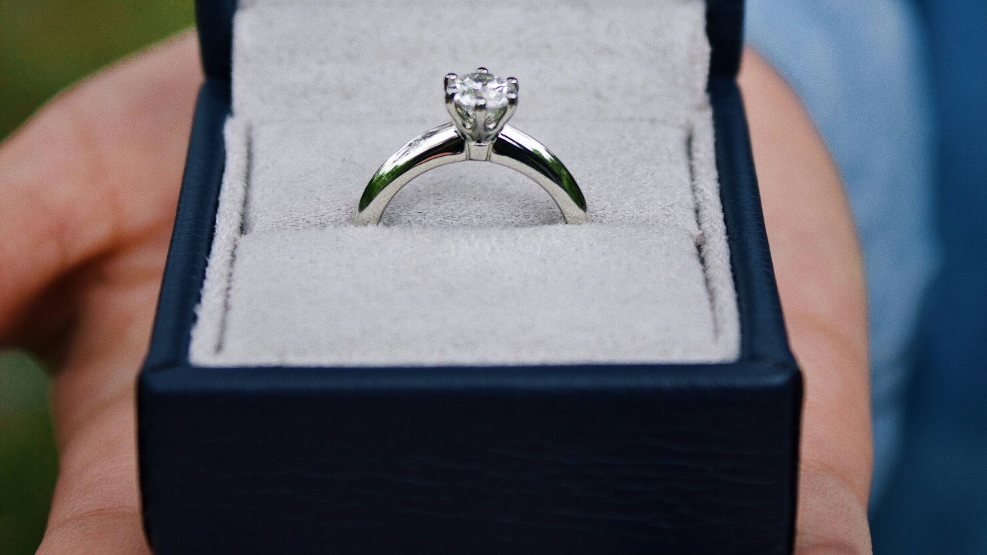 silver-colored solitaire ring