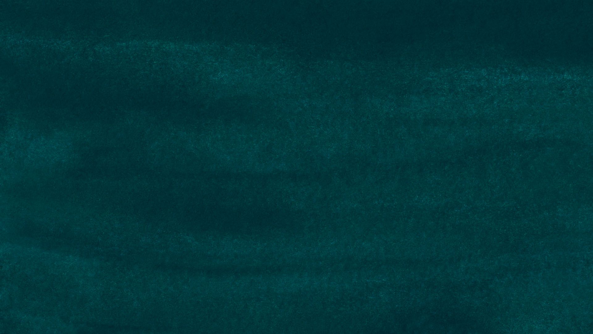 green textile in close up photography