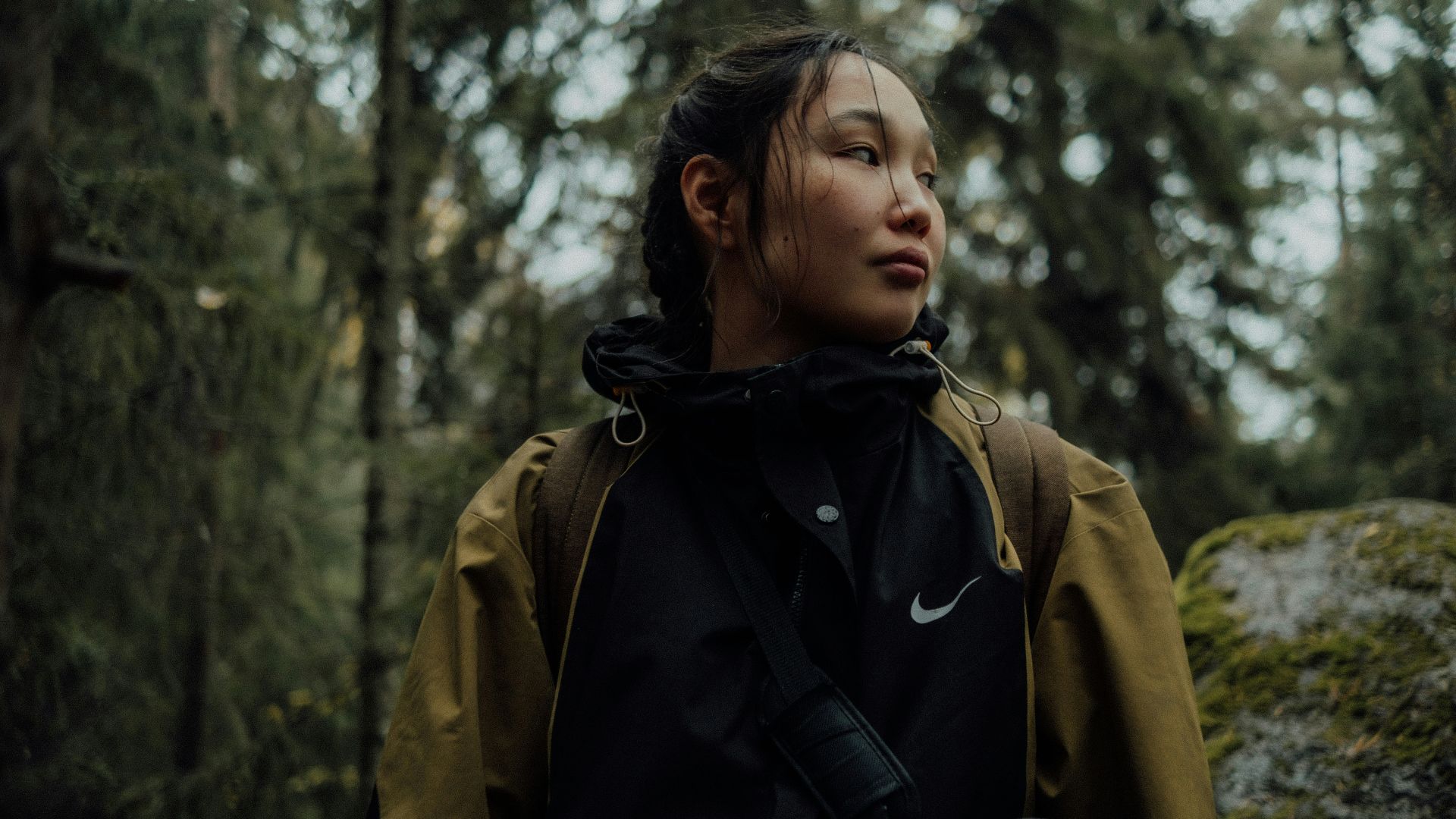 Woman looking out in a forest setting
