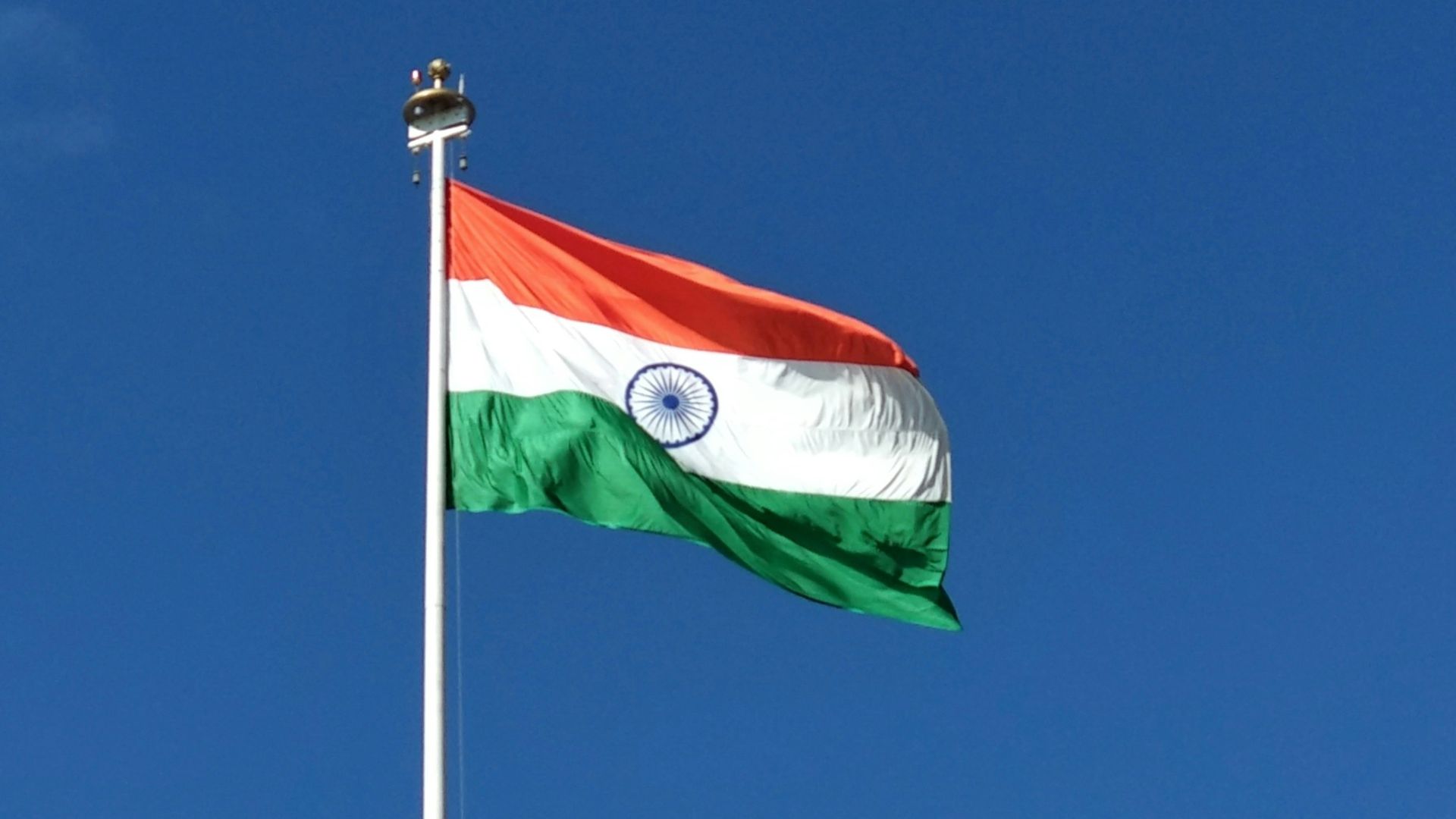red white and green flag under blue sky during daytime