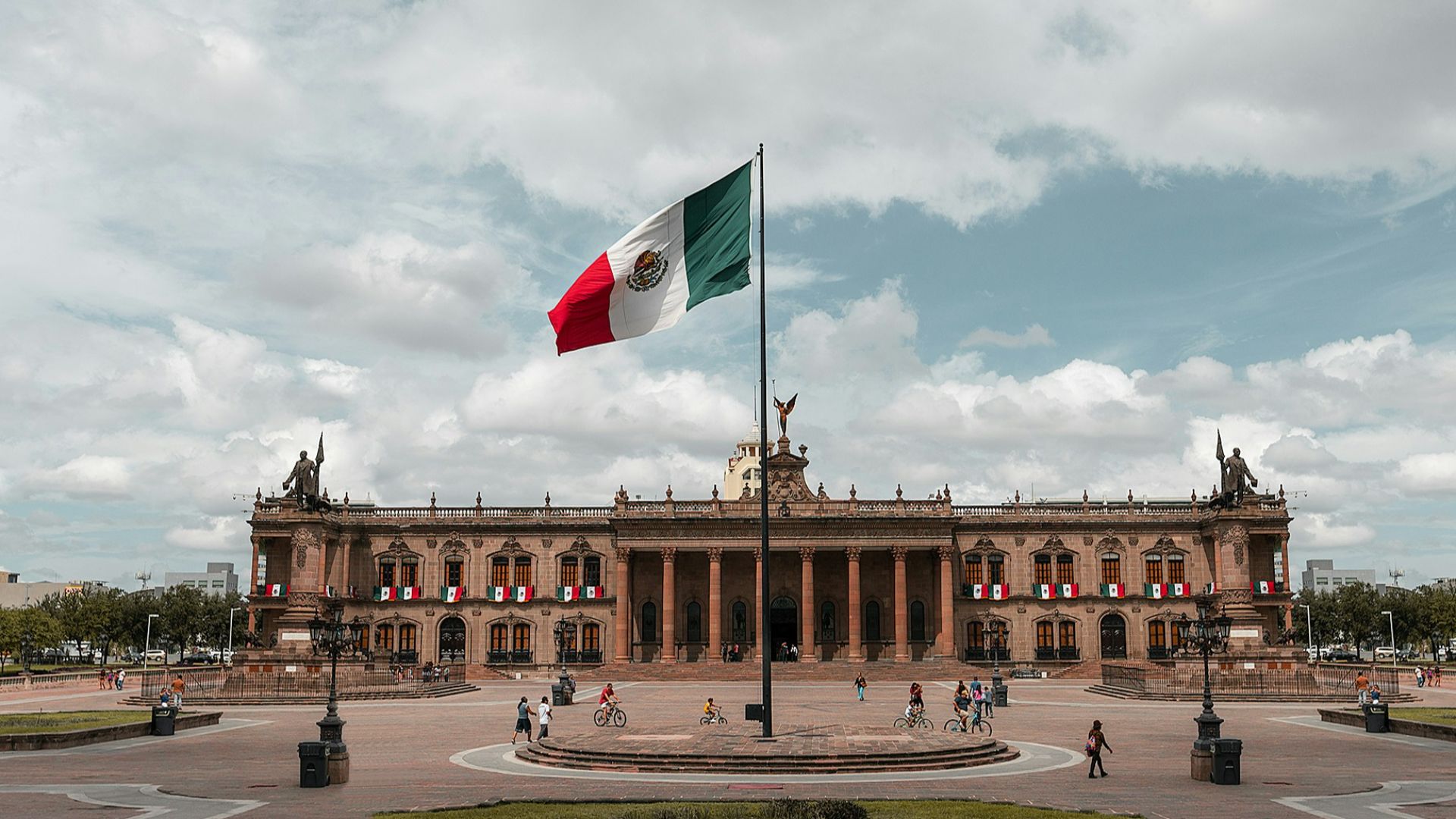 white, green, and red flag near building during daytime photo