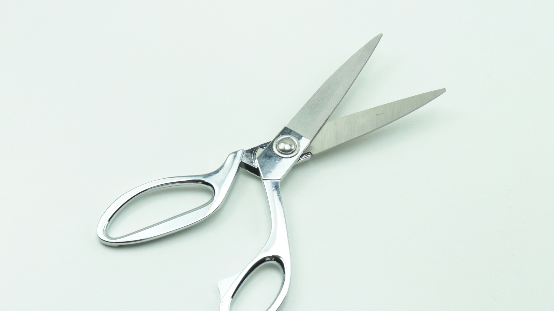 a pair of scissors sitting on top of a table