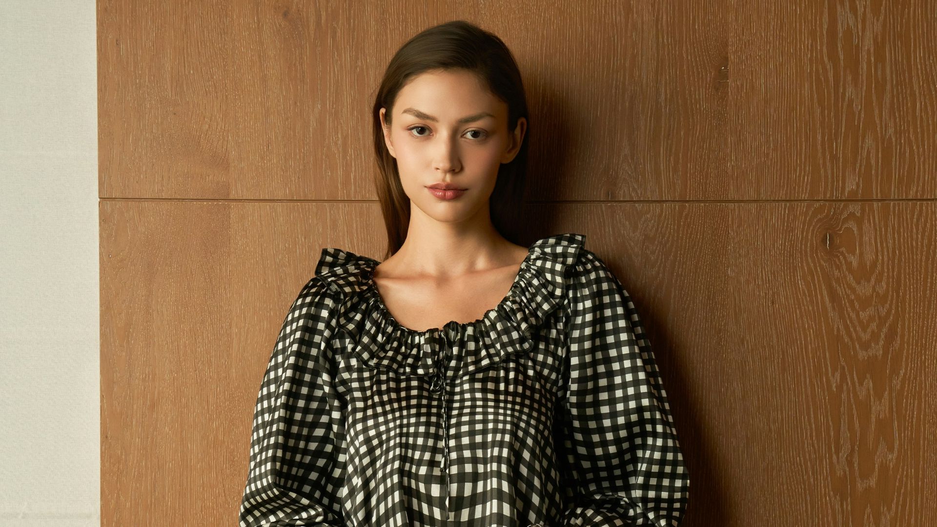 Woman wearing a black and white checkered outfit