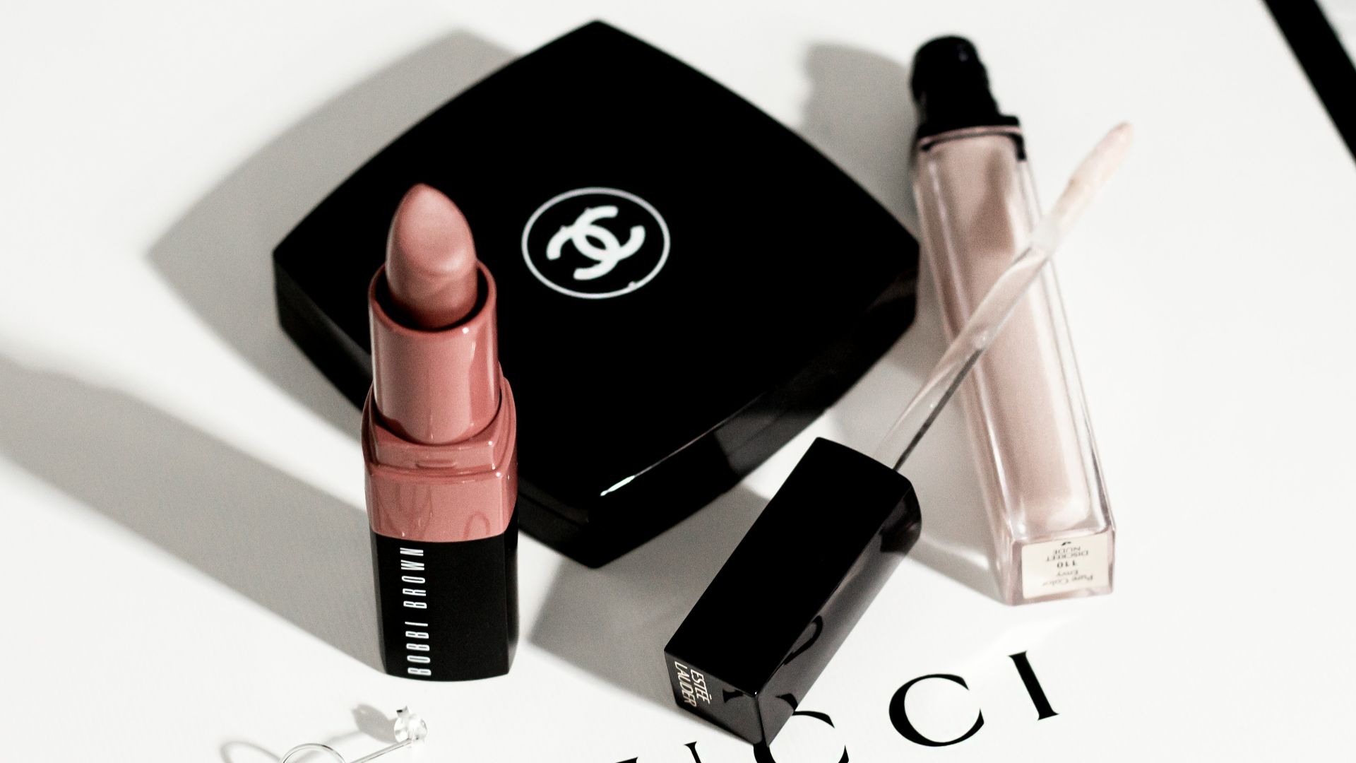 black and pink lipstick and black eyeshadow palette