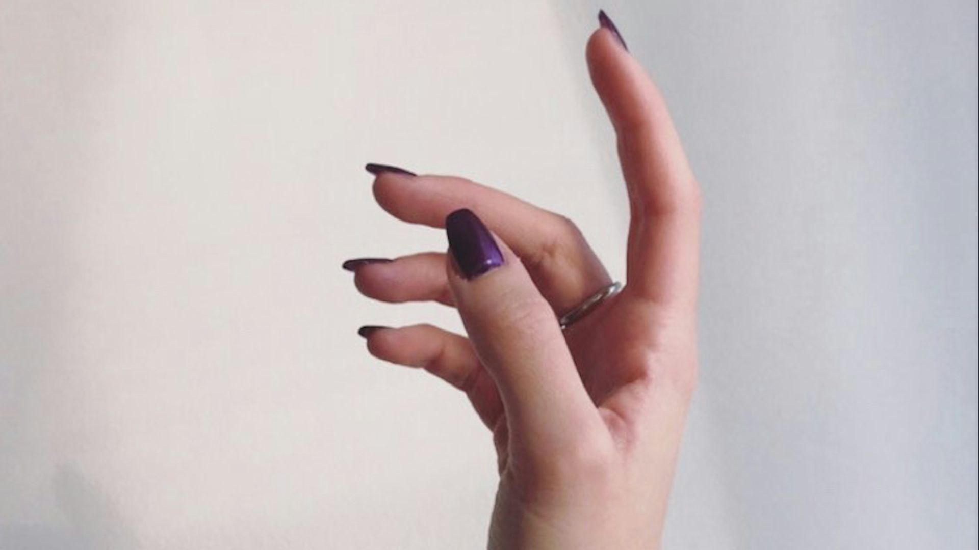 persons left hand on white wall