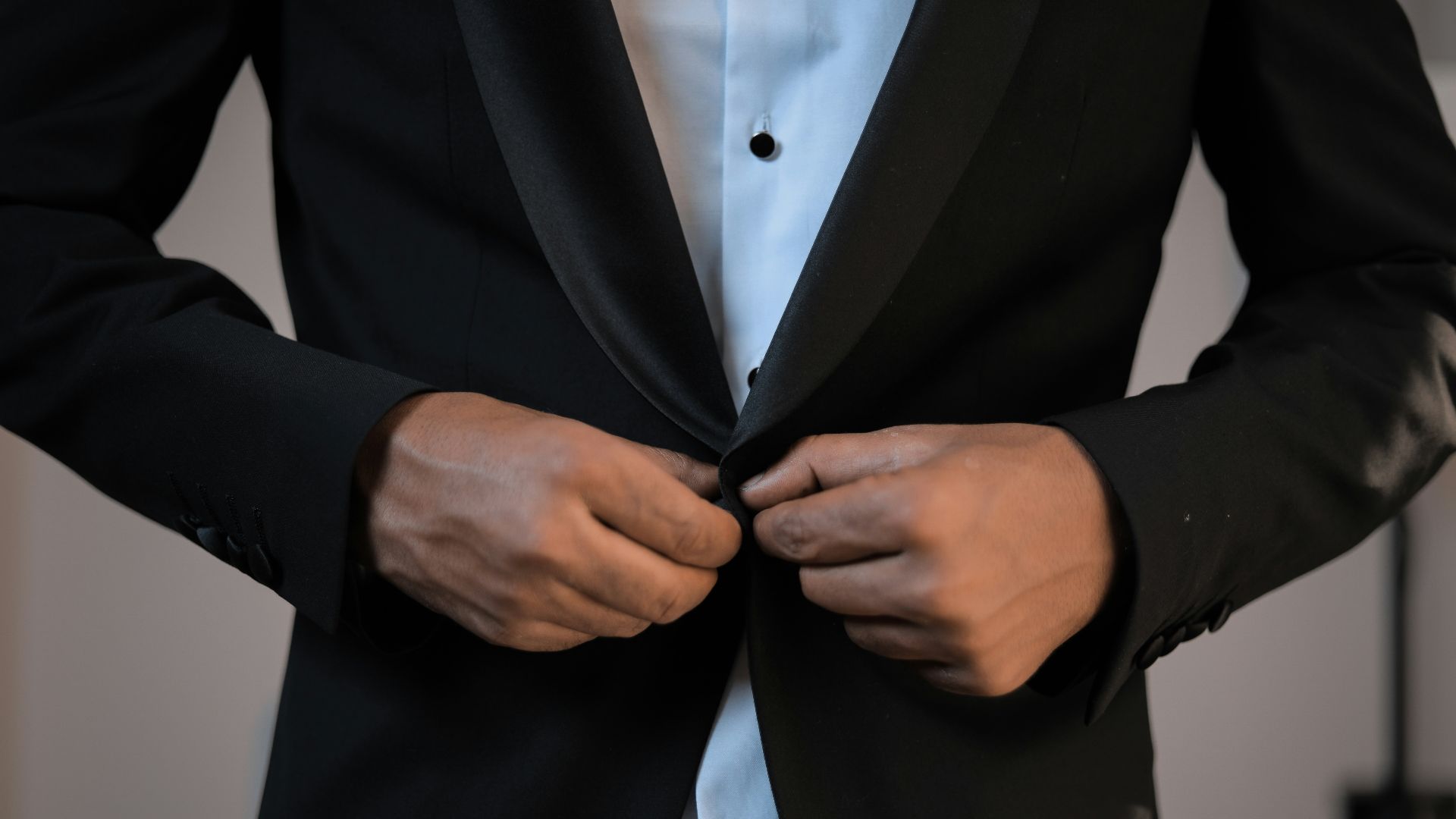 man wearing black suit jacket