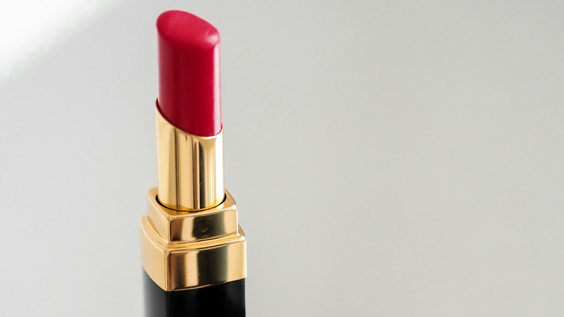 red lipstick on white table