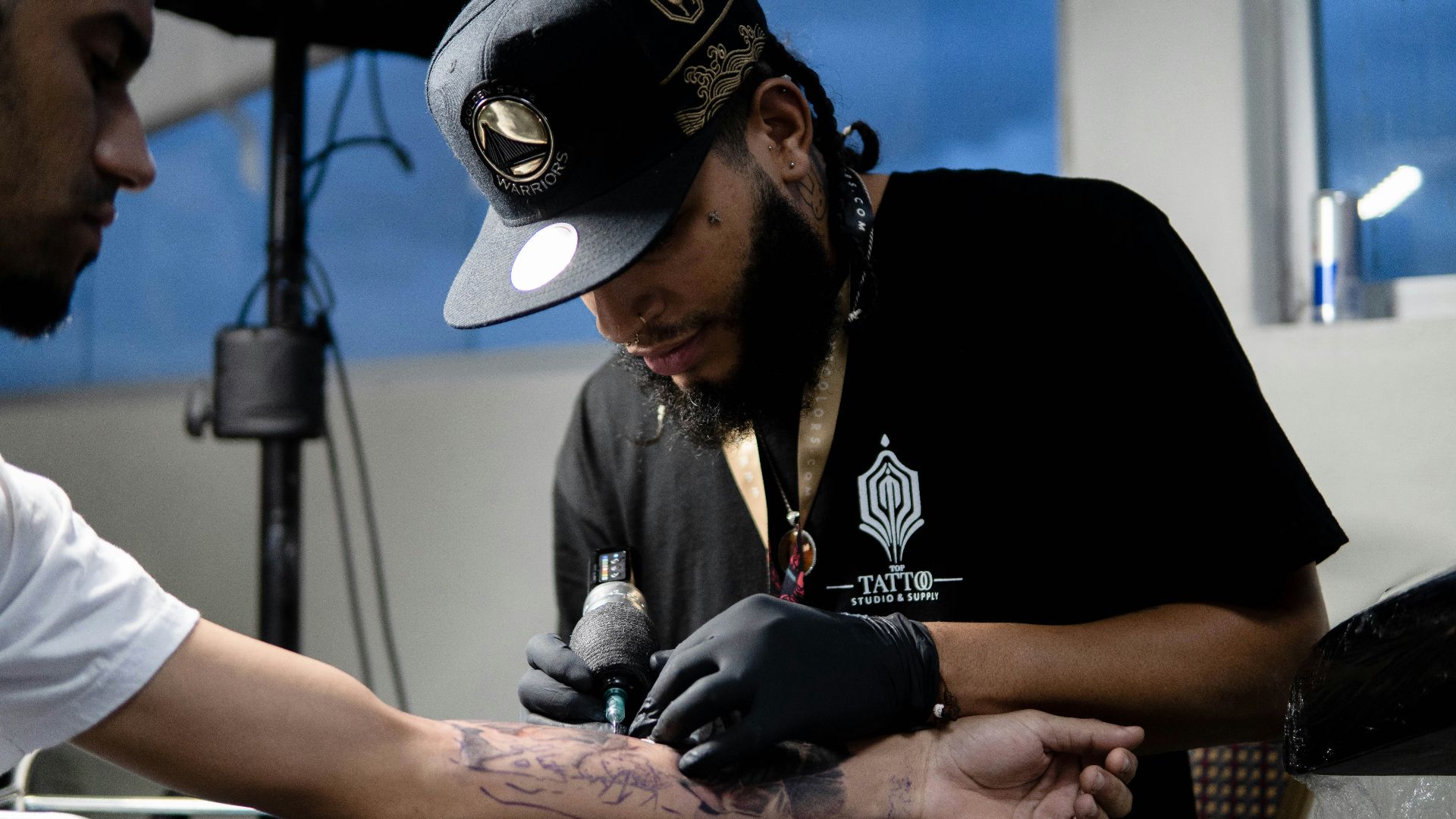a man wearing a black hat