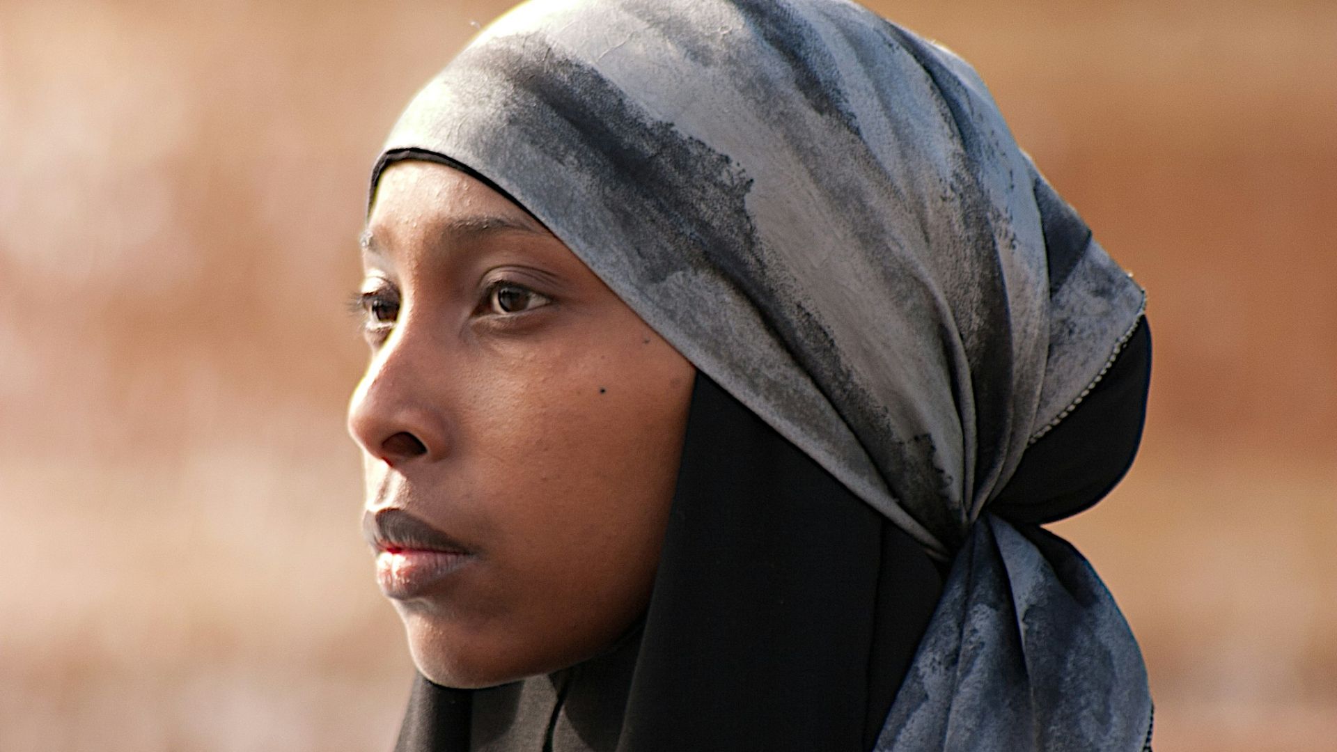 woman in blue hijab in close up photography