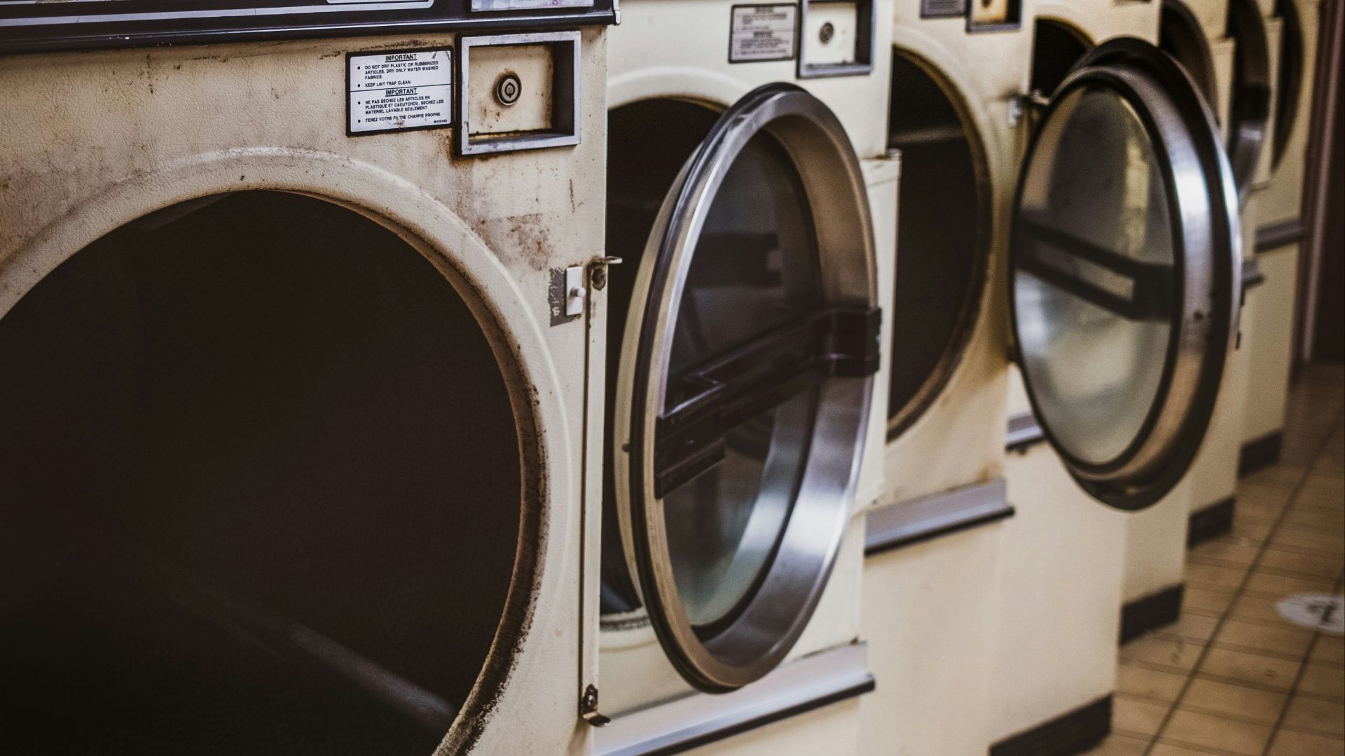 white and silver front load washing machine
