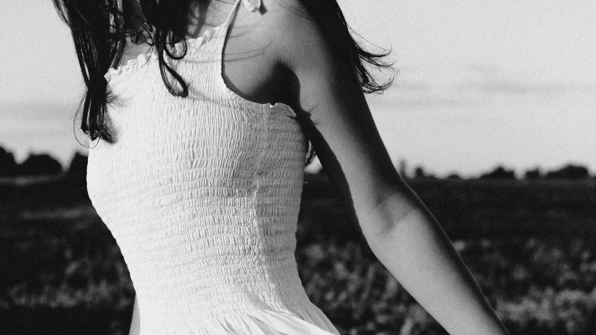 grayscale photo of woman in white dress