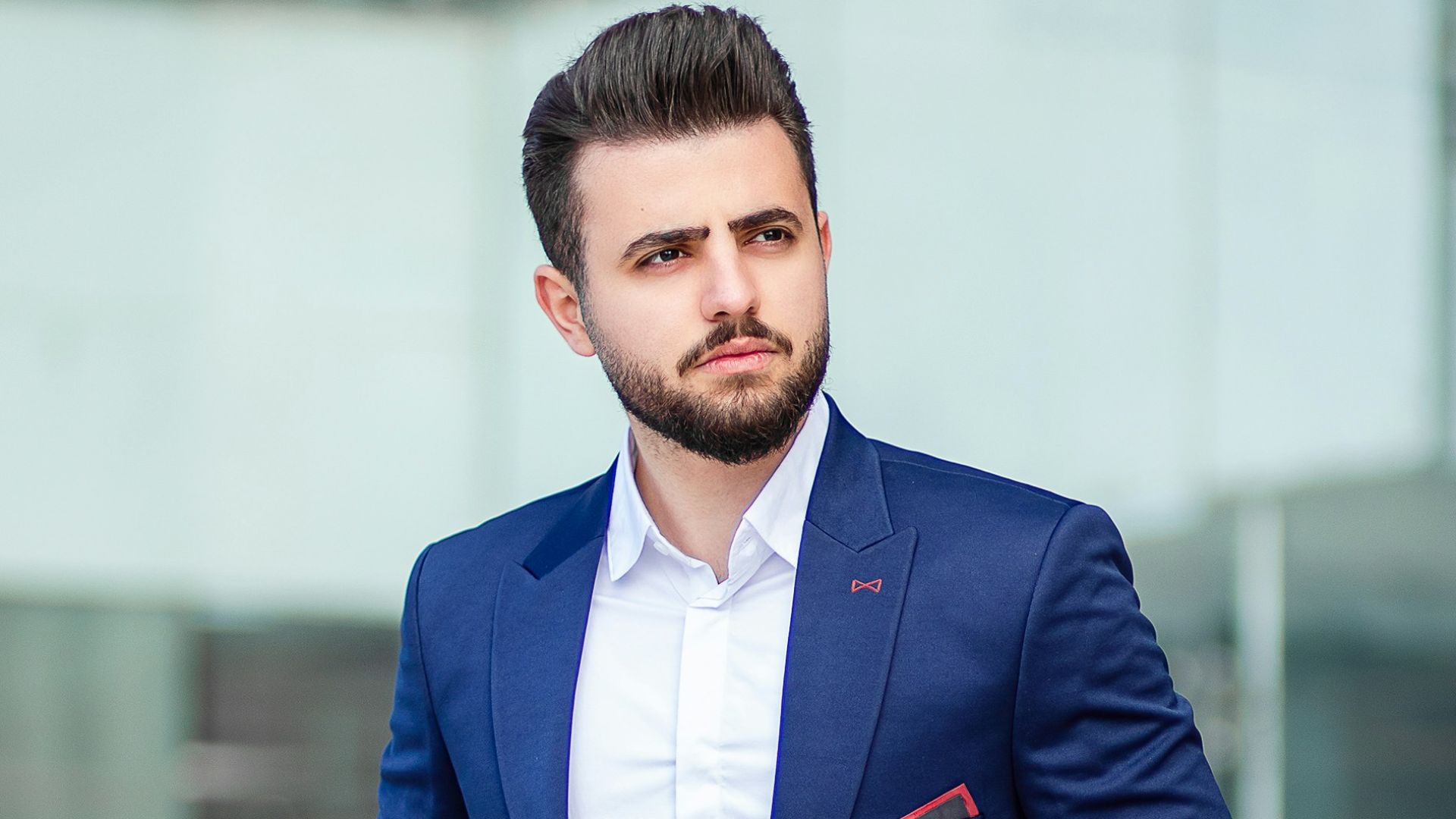 man in blue suit standing