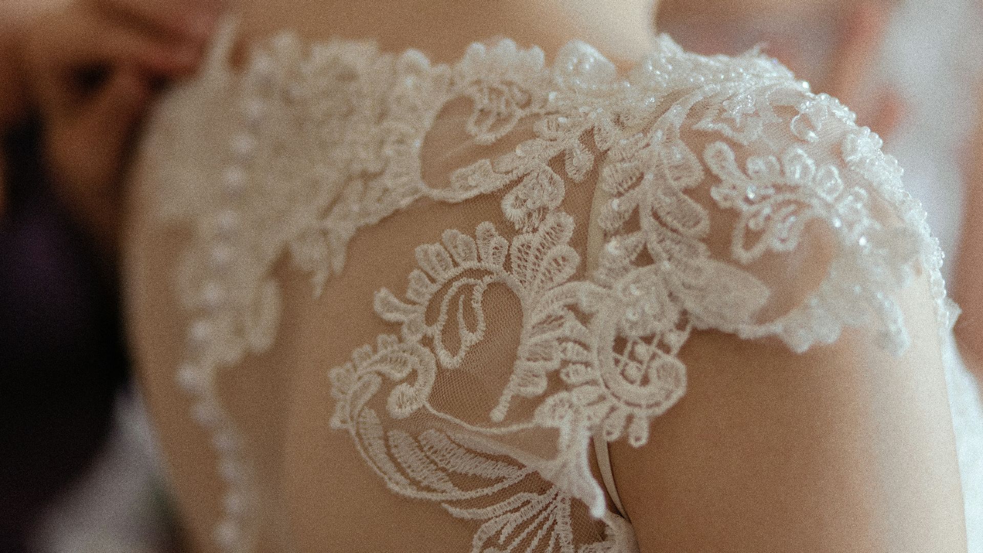 woman wearing white sheer lace wedding gown