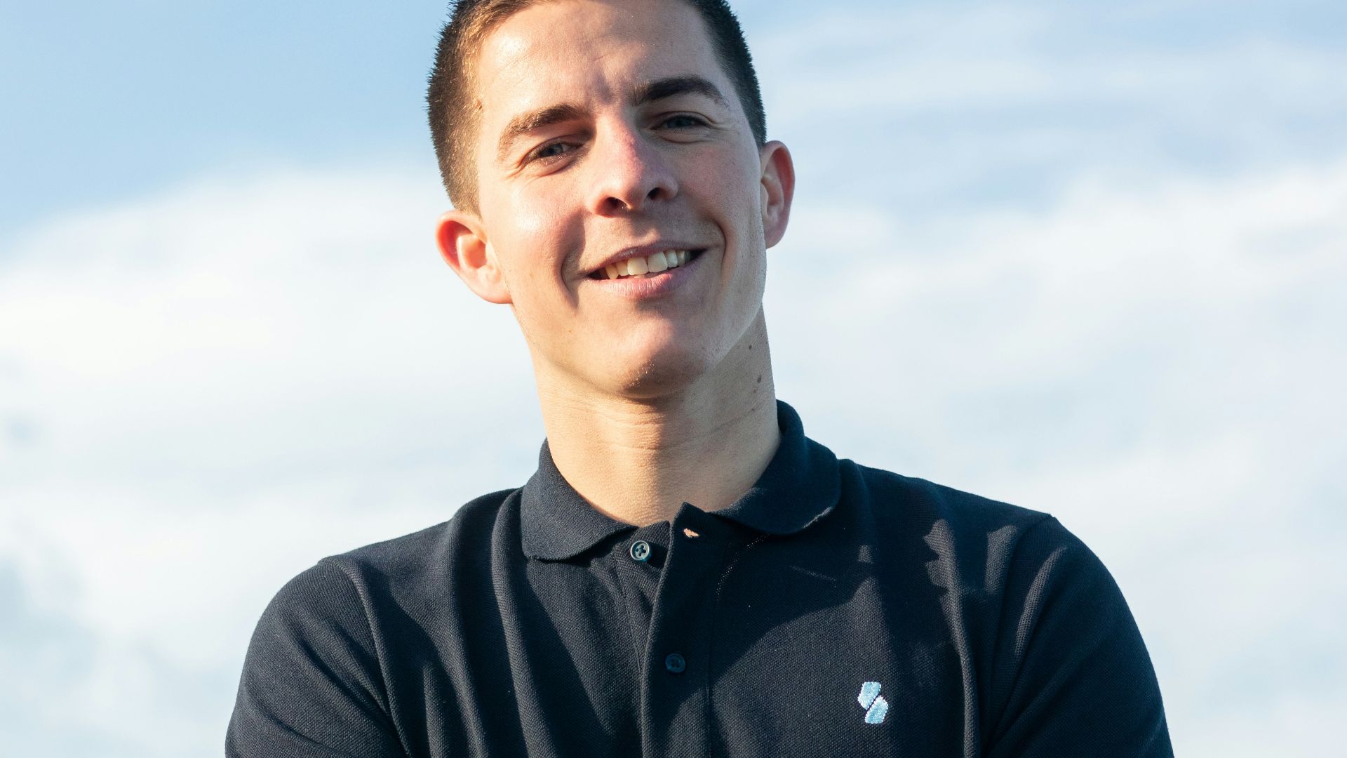 man in black polo shirt